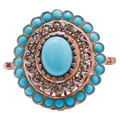Anello con turchese, diamanti, oro rosa e argento.