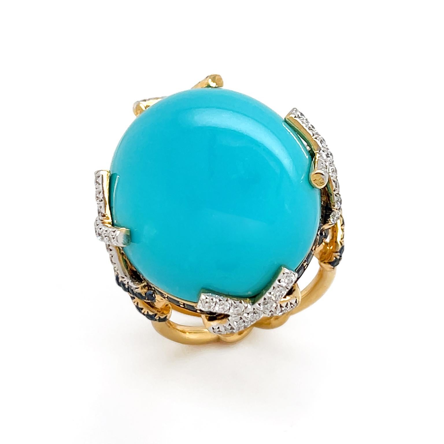 The polished blue-green beauty of turquoise is enhanced by precious gemstones of diamonds and sapphires for this ring. An oval cabochon turquoise is an apex, held in place by intercrossed 18k yellow gold strands with pavé-set brilliant cut diamonds.