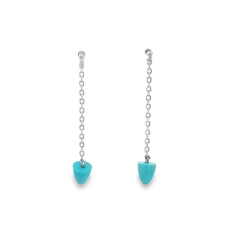 Indulge in the exquisite elegance of these drop-down earrings, meticulously handcrafted to perfection. The earrings feature a breathtaking arrangement of turquoise, weighing 2.13 carats, perfectly showcasing the inherent beauty of the gemstone. The