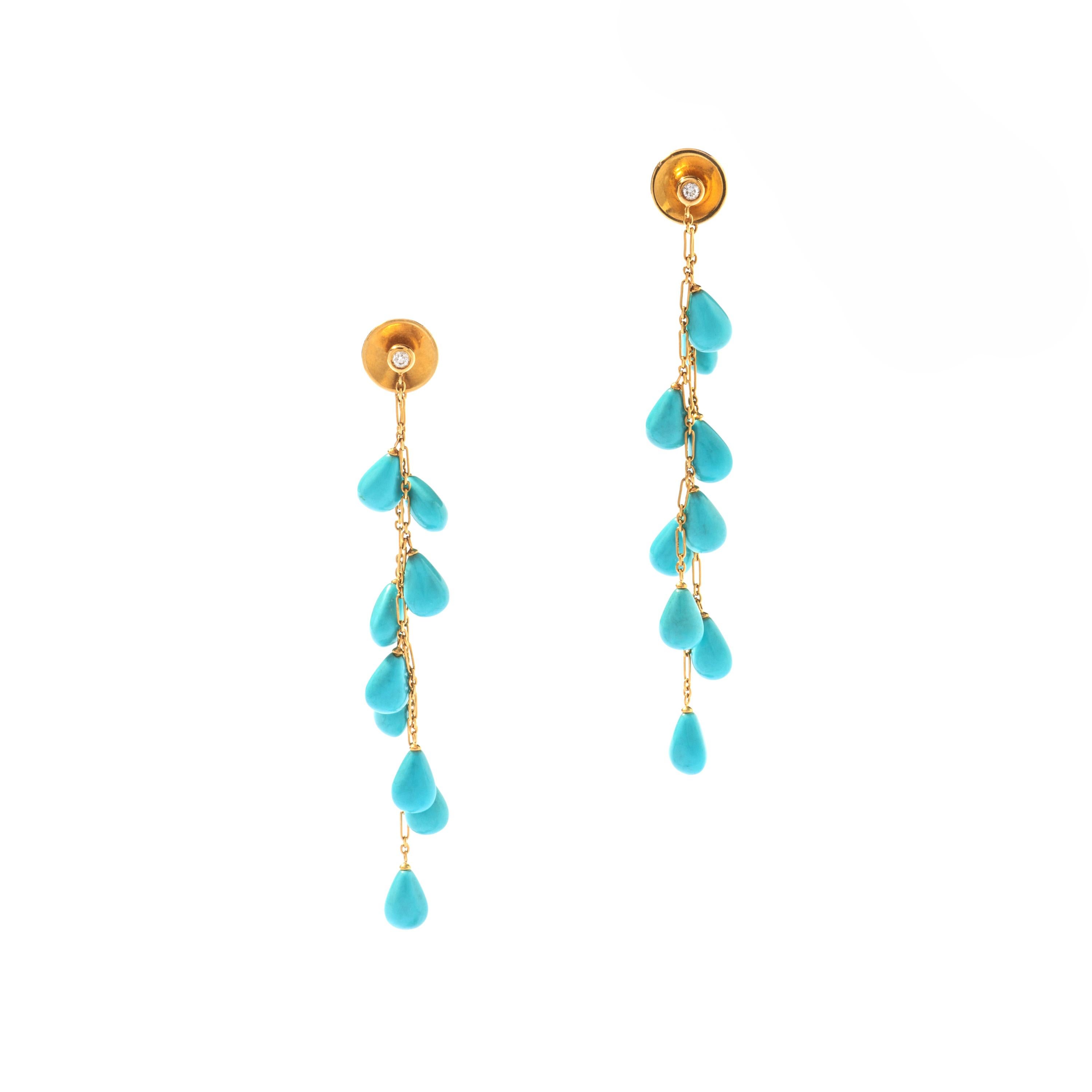 Turquoise drops and Diamond on yellow Gold 18k Ear pendants.
Circa 1980.

Total height: 7.50 centimeters
Total weight: 8.59 grams