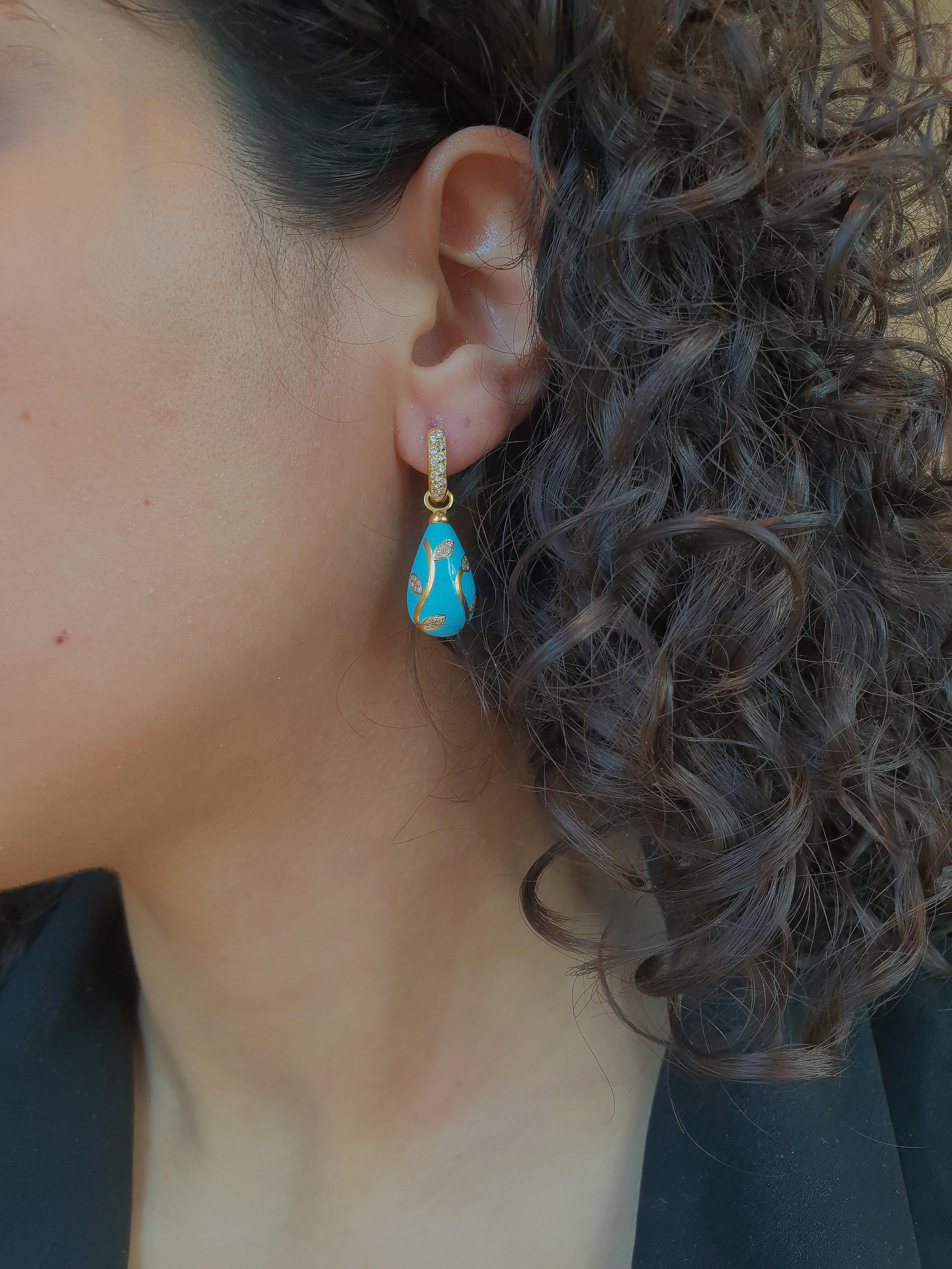 Earrings sculpted in top quality iranese turquoise with floral decoration executed with high carat yellow gold inlay and set with faceted diamonds.

Admire the beauty and craftsmanship of this earrings, a piece that is truly unique; you will not