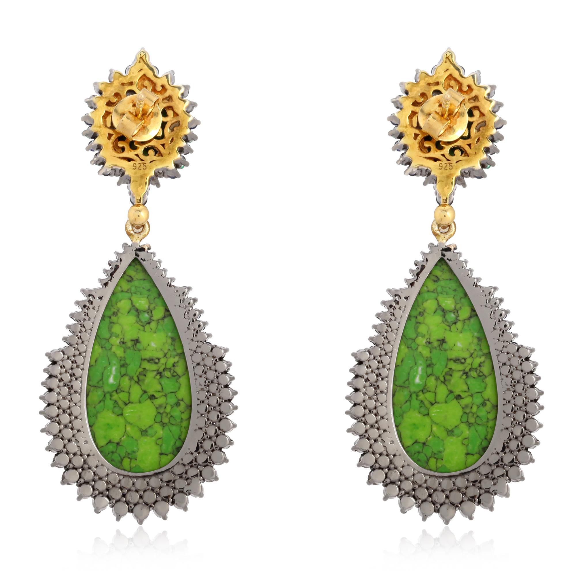 These beautiful earrings are meticulously crafted in 18-karat gold and sterling silver. It is set in 21.8 carats Turquoise, 1.44 carats Emerald, 1.98 carats Sapphire and 1.62 carats of diamonds. 

FOLLOW  MEGHNA JEWELS storefront to view the latest