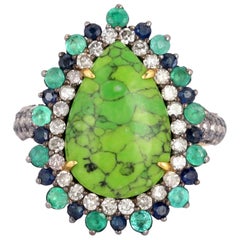 Anello con diamante e smeraldo turchese