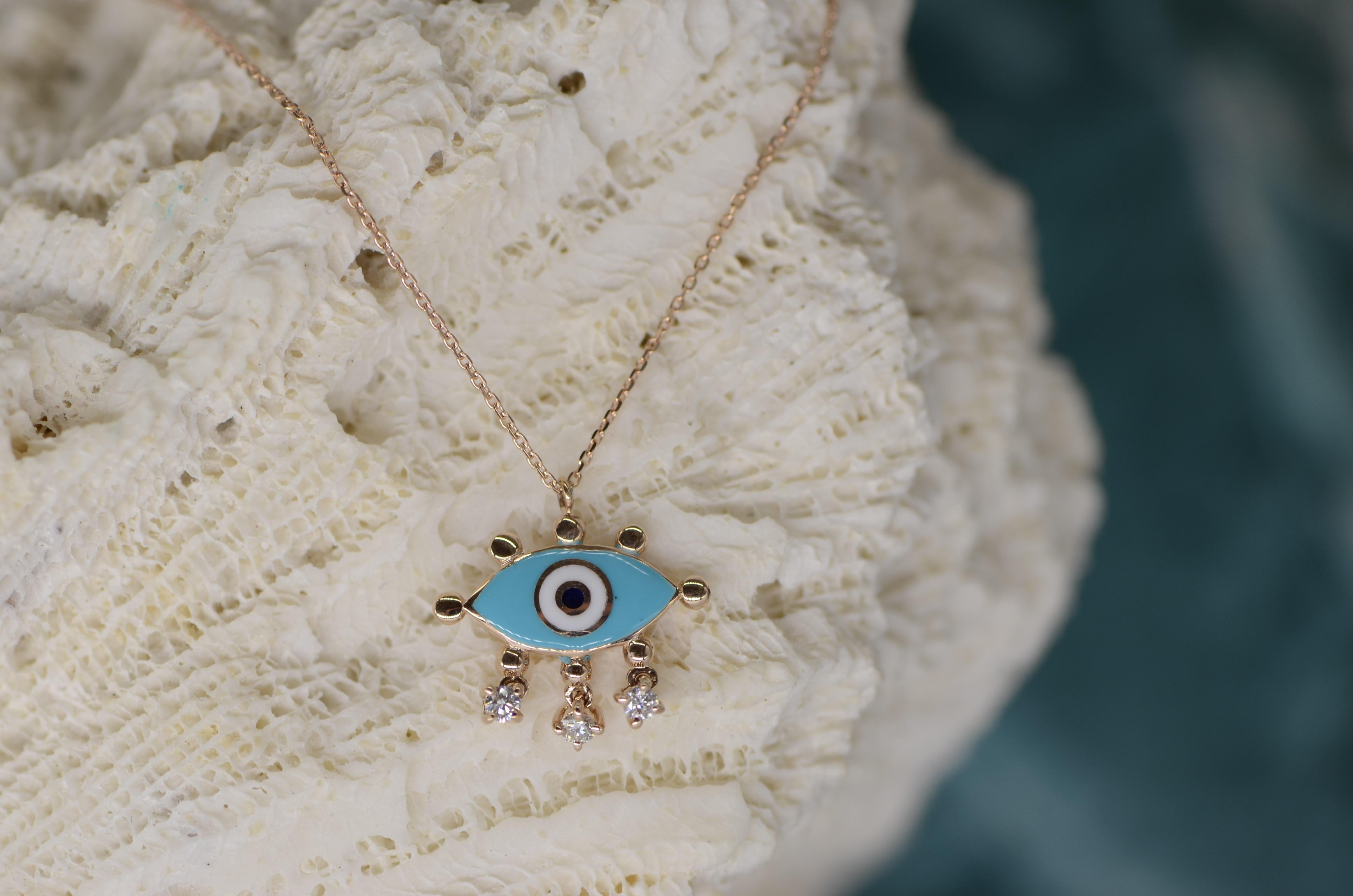 Turquoise evil eye necklace in 14k rose gold with diamond by Selda Jewellery

Additional Information:-
Collection: Art Of Giving Collection
14k Rose gold
0.08ct White diamond
Pendant height 1.5 cm
Chain length 42cm