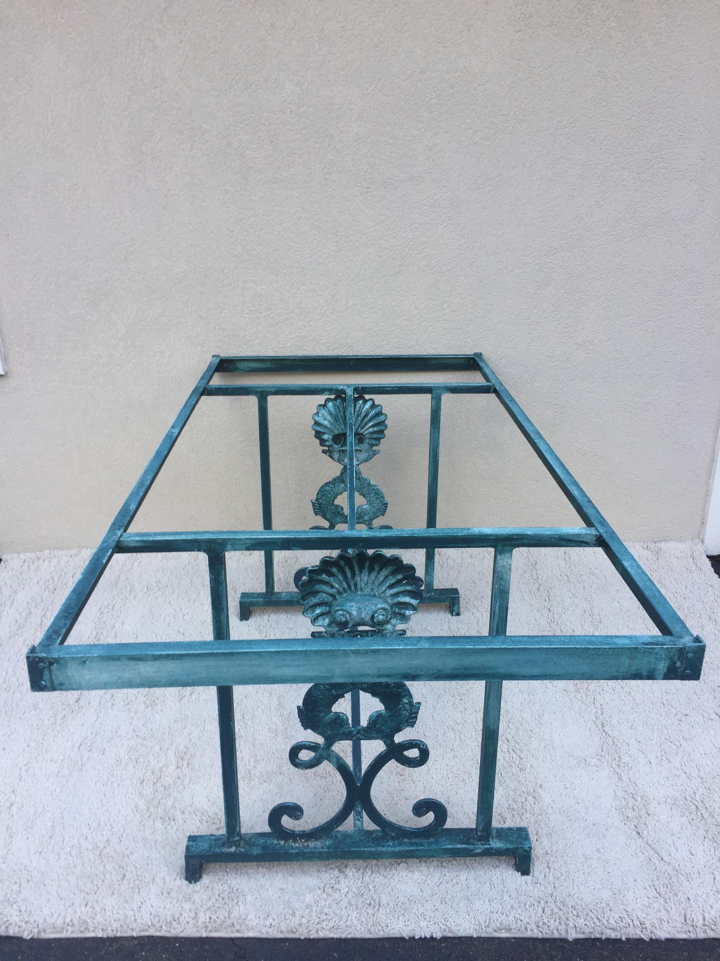 Turquoise finished aluminum Glass top dolphin and sea shell designed dining Table 1/2” glass top with patinated turqouise color which is original and been glazed.