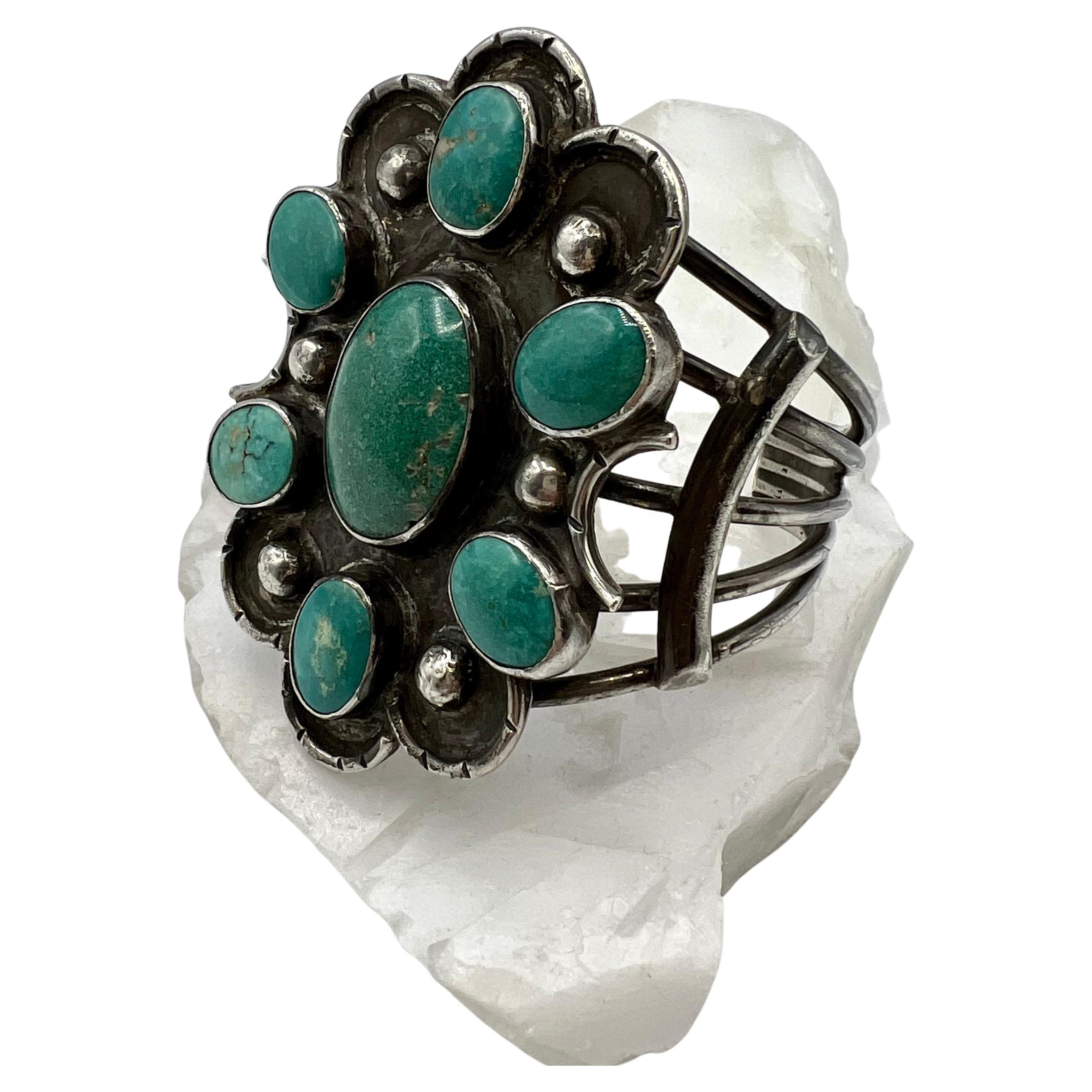 This large size cuff set with amazing matching Turquoise in a floral pattern is beautifully matched. The sterling silver has an oxidized finish and a dot pattern. The cuff is very comfortable to wear and can be adjusted to fit your wrist.