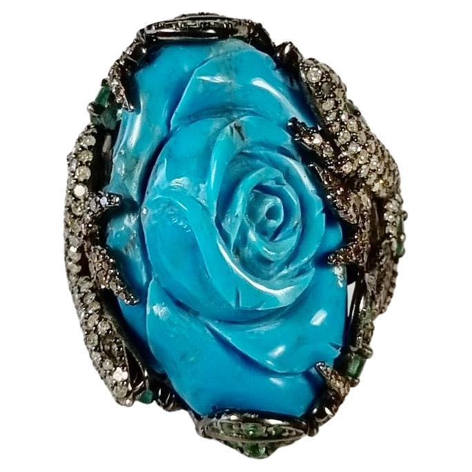 Irama Pradera is a Young designer from Spain that searches always for the best gems and combines classic with contemporary mounting and styles. 
Turquoise Flower Ring with Diamonds and Emeralds in 18k Gold and Silver
Sleekly crafted in 18K yellow