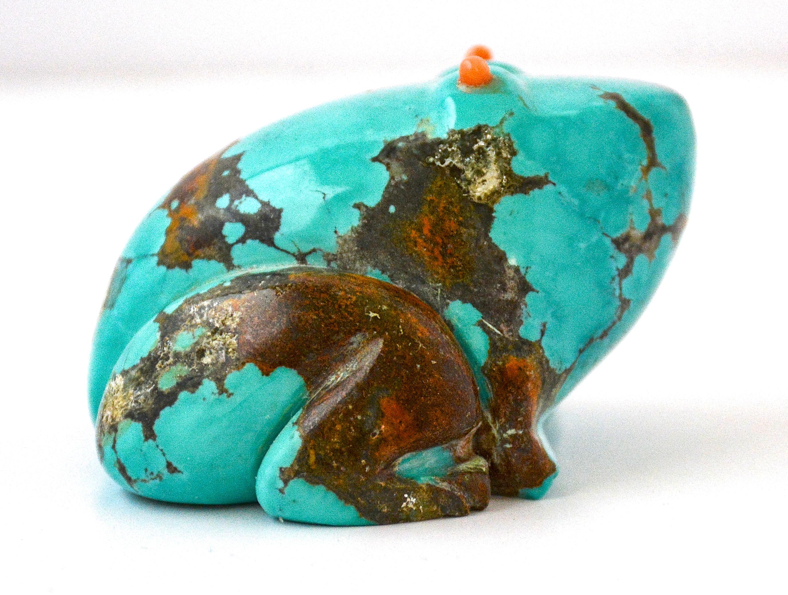 Frog Fetish
Turquoise and coral 
Sarah Pino
1990
Measures: 1.75 inches H. x 2.50 inches L. x 2.25 inches W.


This wonderful frog fetish was carved from a single piece of turquoise by Navajo carver Sarah Pino in 1990. It is in perfect