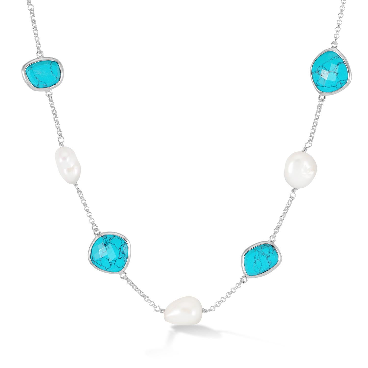 Handcrafted in sterling silver, this chain necklace is adorned with five white baroque pearls and four faceted turquoise gemstones. Baroque pearls are naturally irregular in shape and known for their one-of-a-kind nature. The piece is complete with