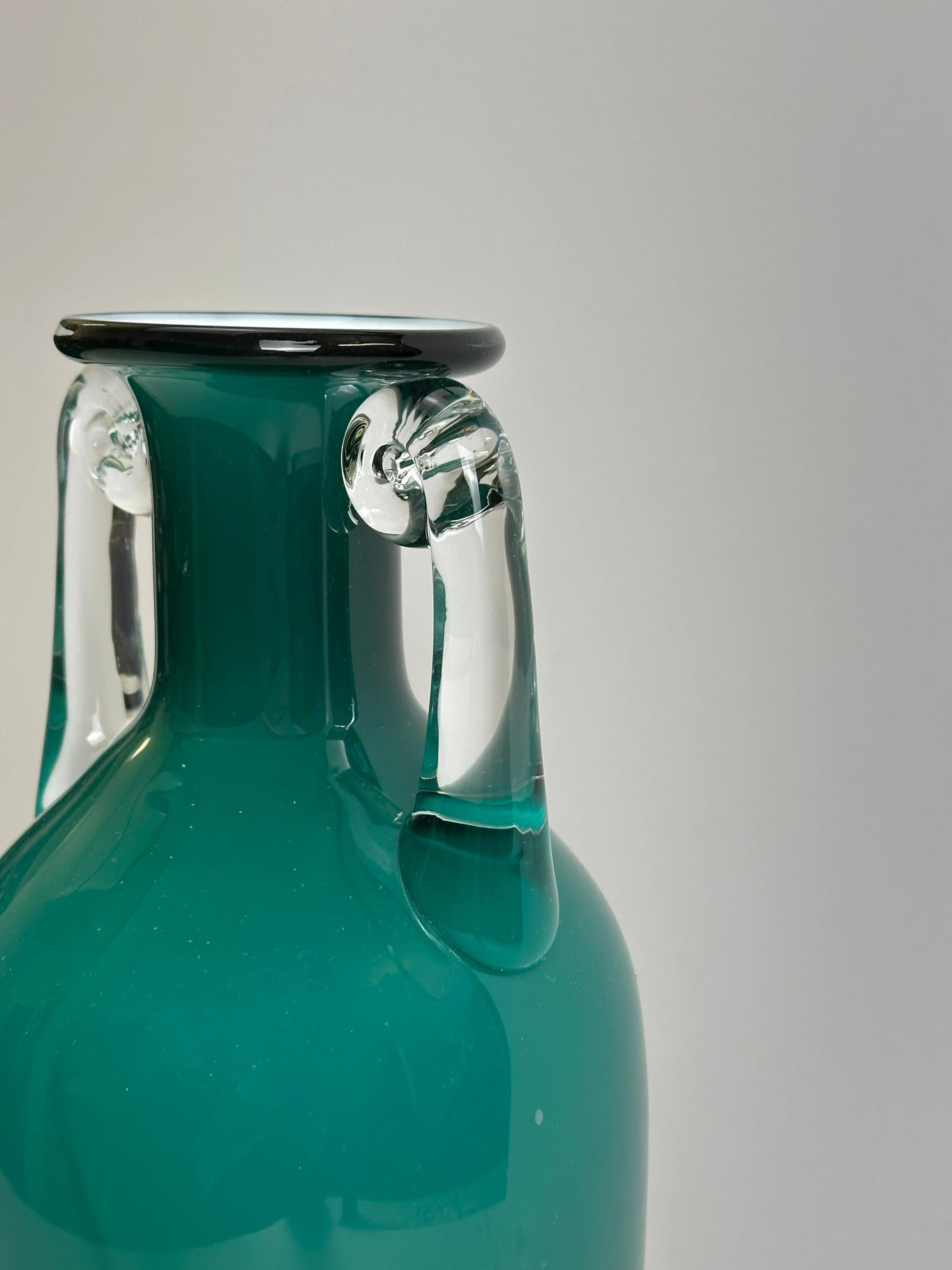 A striking postmodern glass vase designed by renowned Polish glass artist Jerzy Słuczan-Orkusz for Tarnowiec Glassworks in the early 1980s. This distinctive piece reinterprets the classical Grecian amphora form through a bold and minimalist