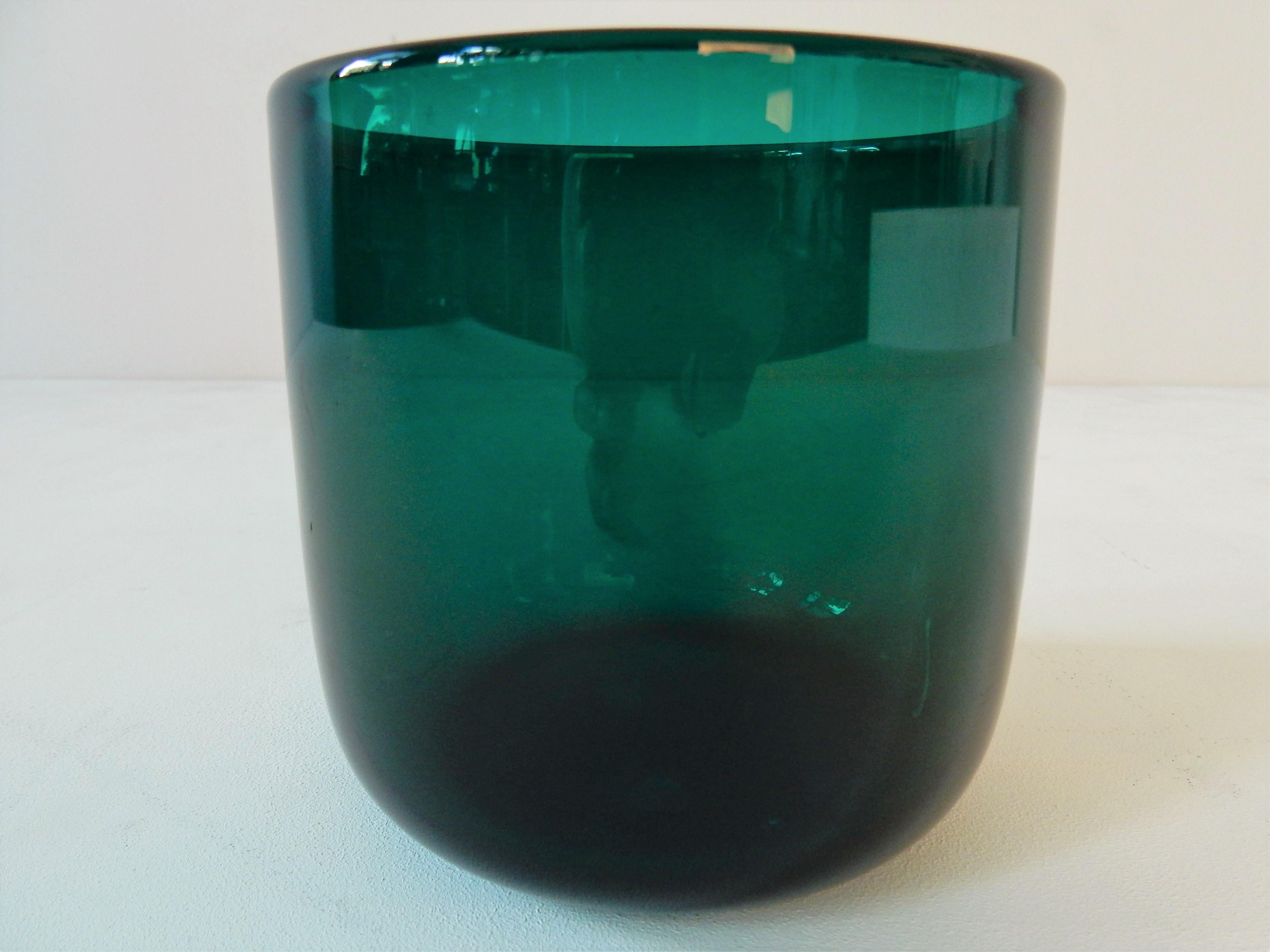 This beautiful turquoise green Grønland (Greenland) flowerpot, was designed by Per Lütken for Holmegaard in 1961. It is marked and signed on the bottom. It has a minor defect to a spot on the top, no chip but maybe a small fabrication fault.