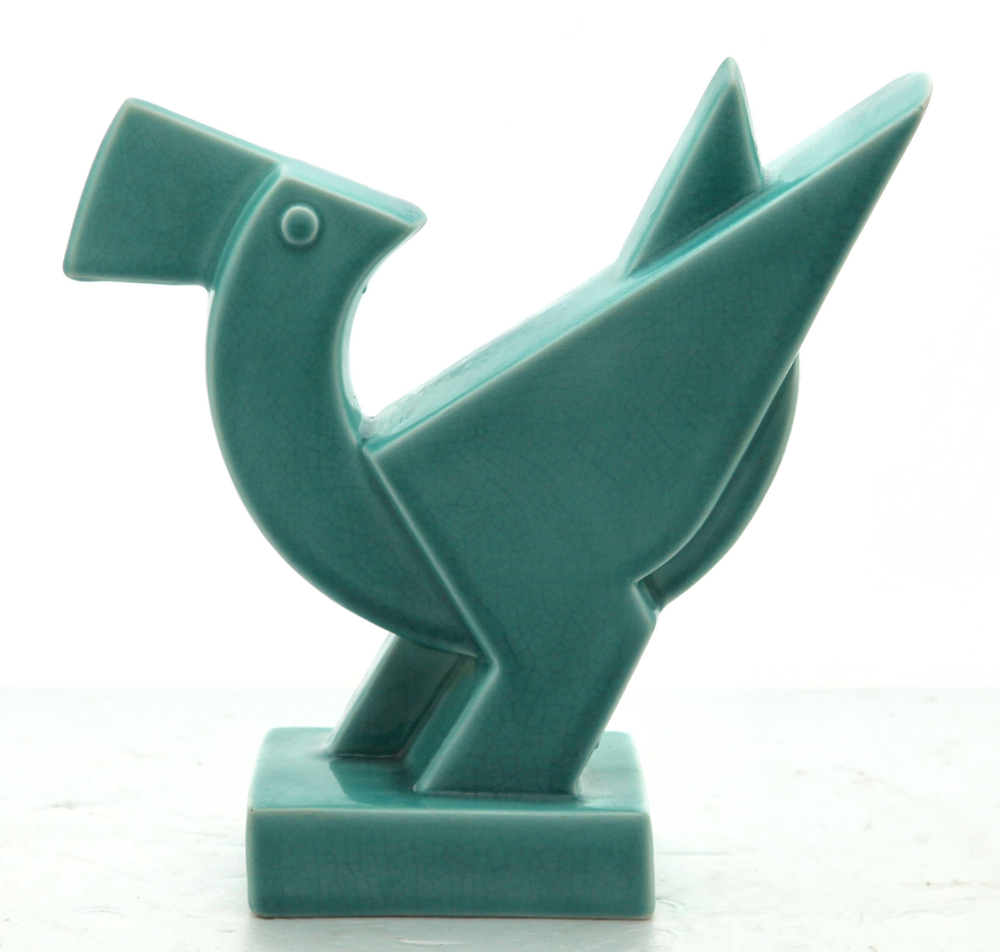 Turquoise glazed 'Art Deco' sculpture of a bird, design De Mey, executed by Nimy / Belgium, circa 1928.
Nimy / Belgium
 
Stamped: Nimy mark with Manufacture Imperial Royale, Nimy, Fabrication Belge and made in Belgium
Measures: Height
26 cm. /