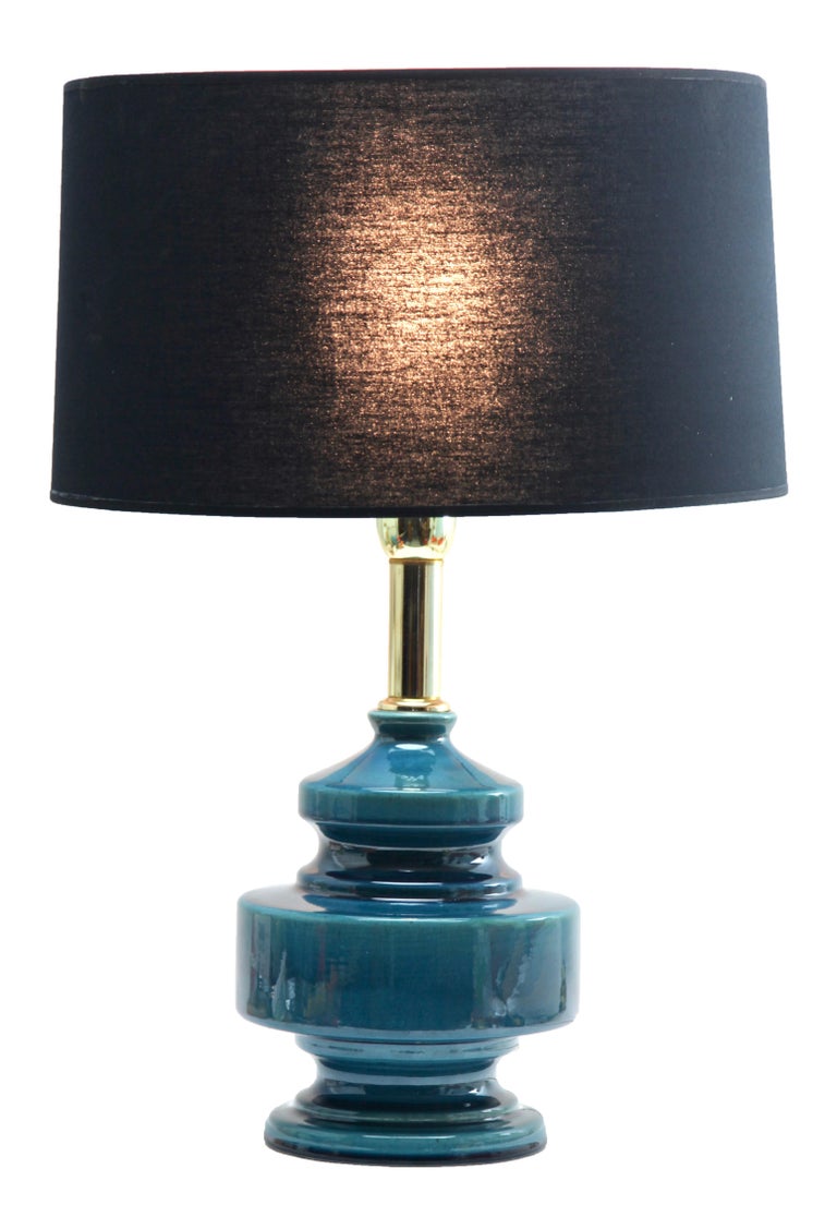 Inspired by a centuries old technique of Chinese ceramics, this elegant table lamp is a bright and dramatic shade of turquoise with a fine crackle glaze.

And safe for immediate usage in the World

Recently cleaned and polished so that it In