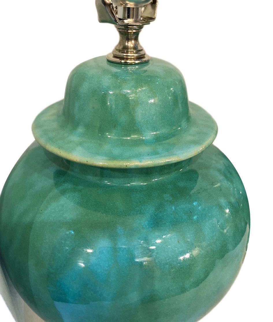 Pair of circa 1940s French turquoise glazed ceramic lamps with silvered bases.

Measurements:
Height of body 12.5
