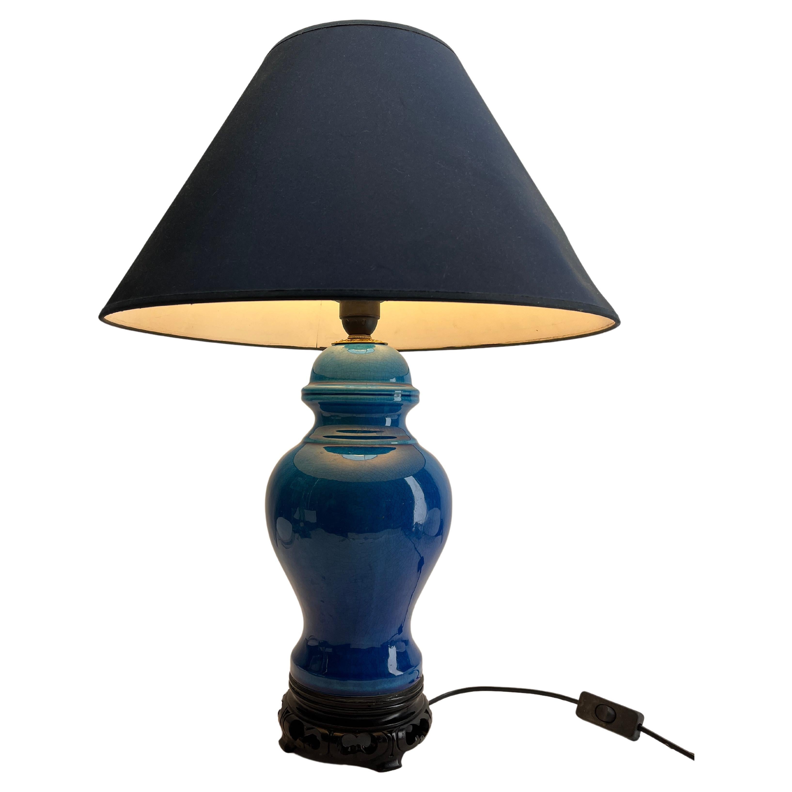 Inspired by a centuries-old technique of Chinese ceramics, this elegant table lamp is a bright and dramatic shade of turquoise with a fine crackle glaze. 
The dimensions are measured without a lampshade.

Renewed and rewired with lamp New fitting