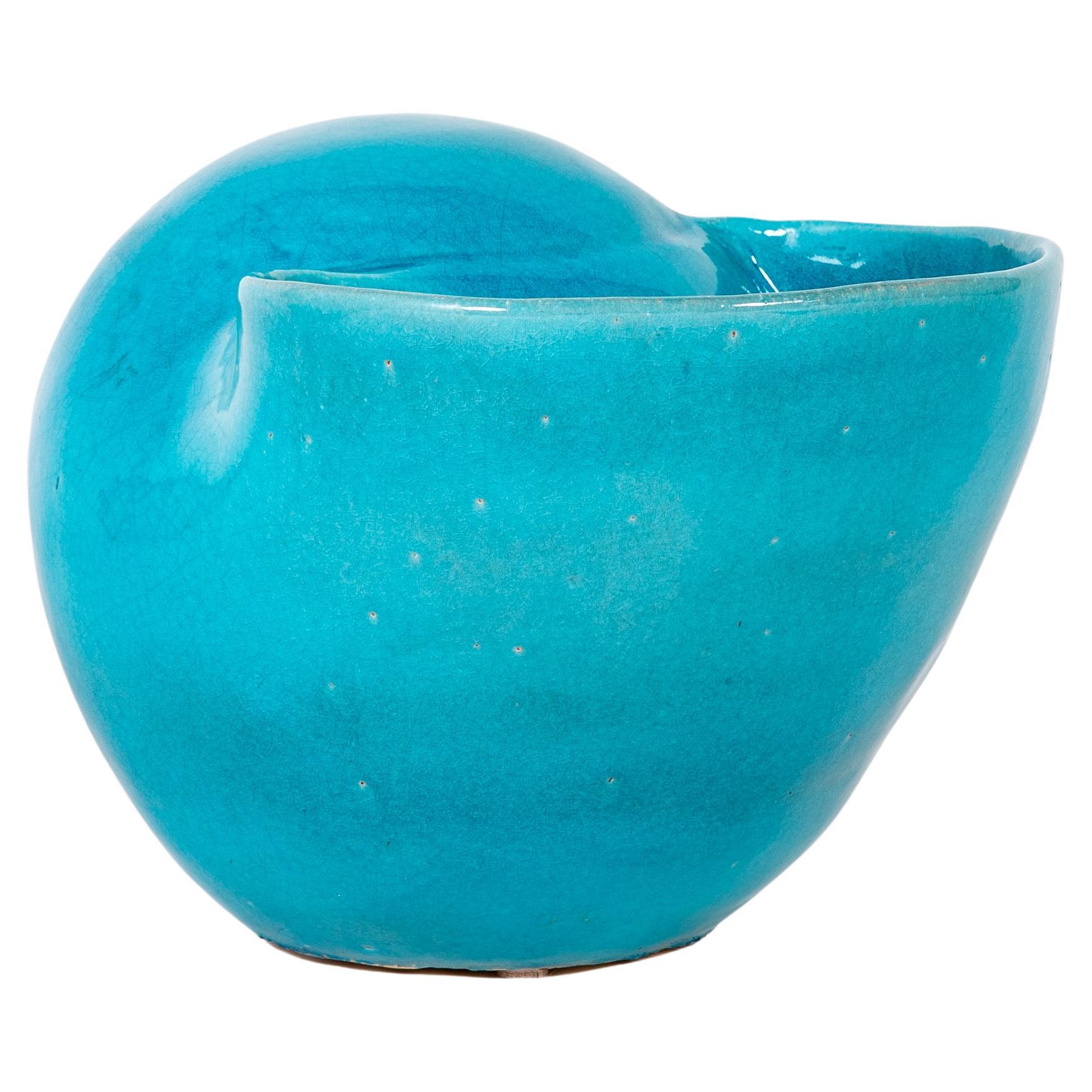 Stunning large scale sea shell turquoise blue glazed ceramic vase. A wonderful piece of sculpture as is, it will also make a fantastic vase or planter. The blue just glows and the form is quite appealing. Stamped with the Chinese symbol for 'hand',