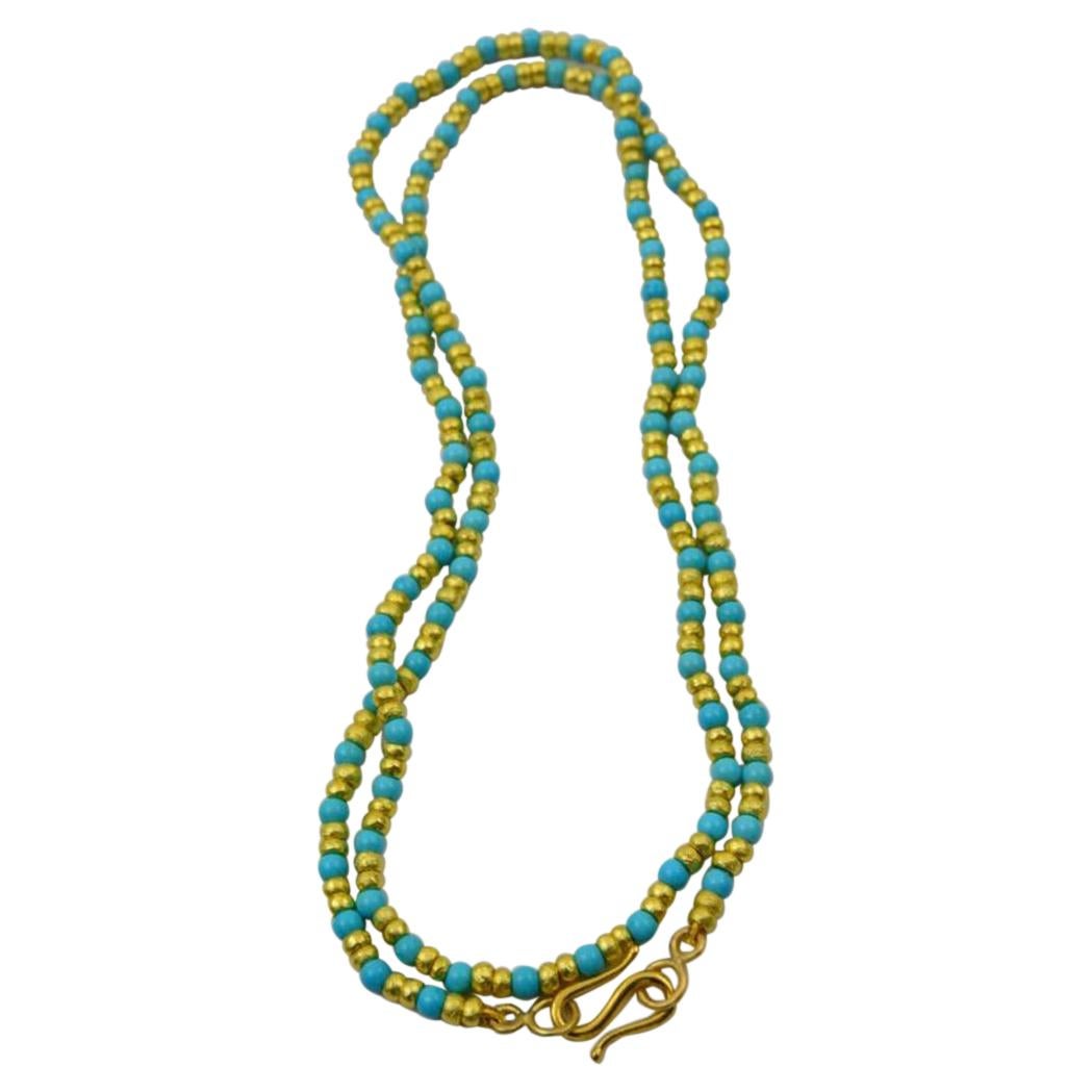 Cant go wrong with this one of a kind turquoise and gold beaded necklace with classic handmade S hook! Wear it long or double it up. 22k gold beads adds all the glamour you need! Pair it with our hammered stacking rings or one of our pendants and