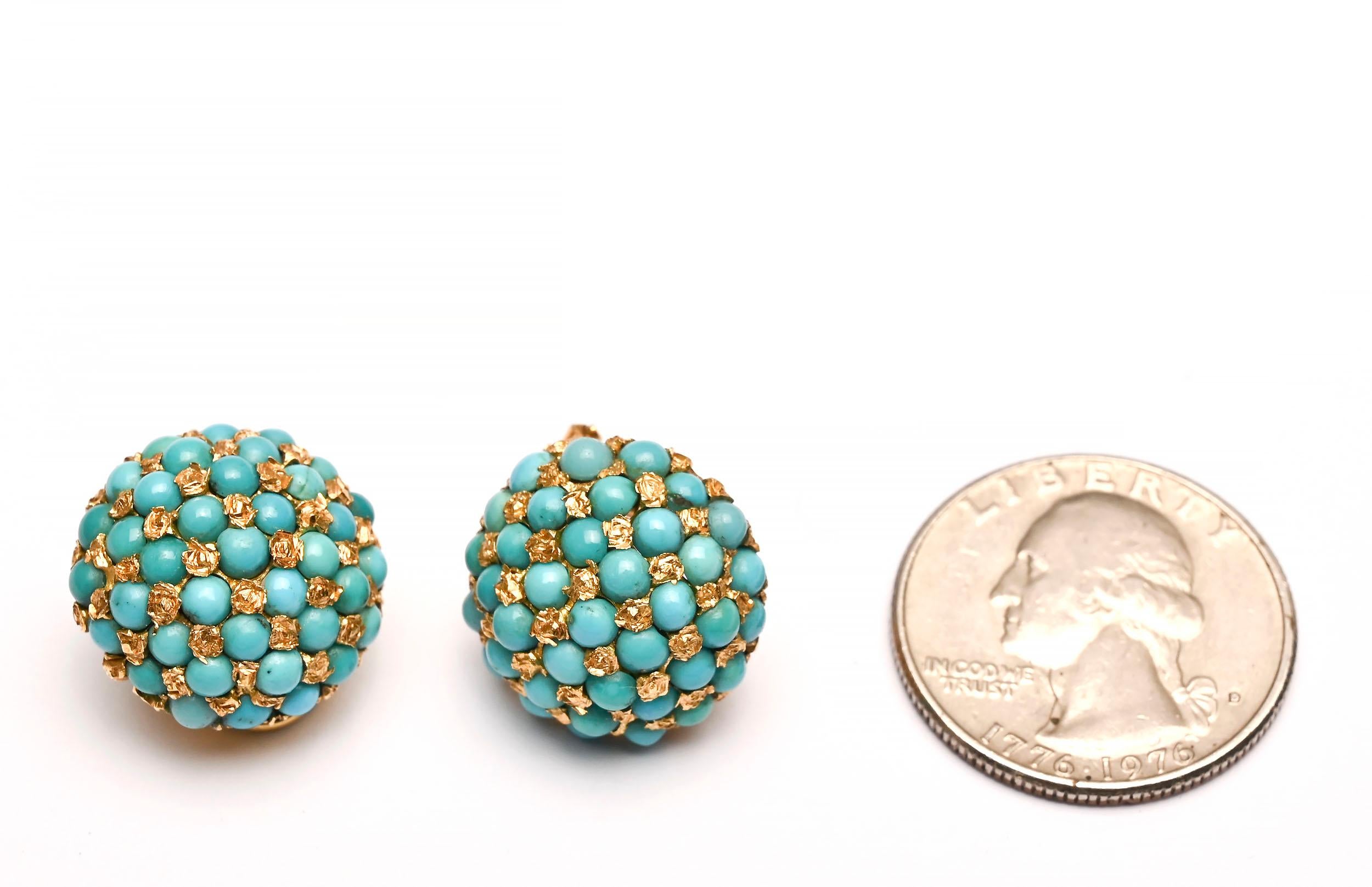 Dome shaped earrings of round turquoise stones set next to textured circles of 18 karat gold. The turquoise is richly colored and well matched. The gold circle in the back is not visible when worn yet the maker decorated it with a scored design,