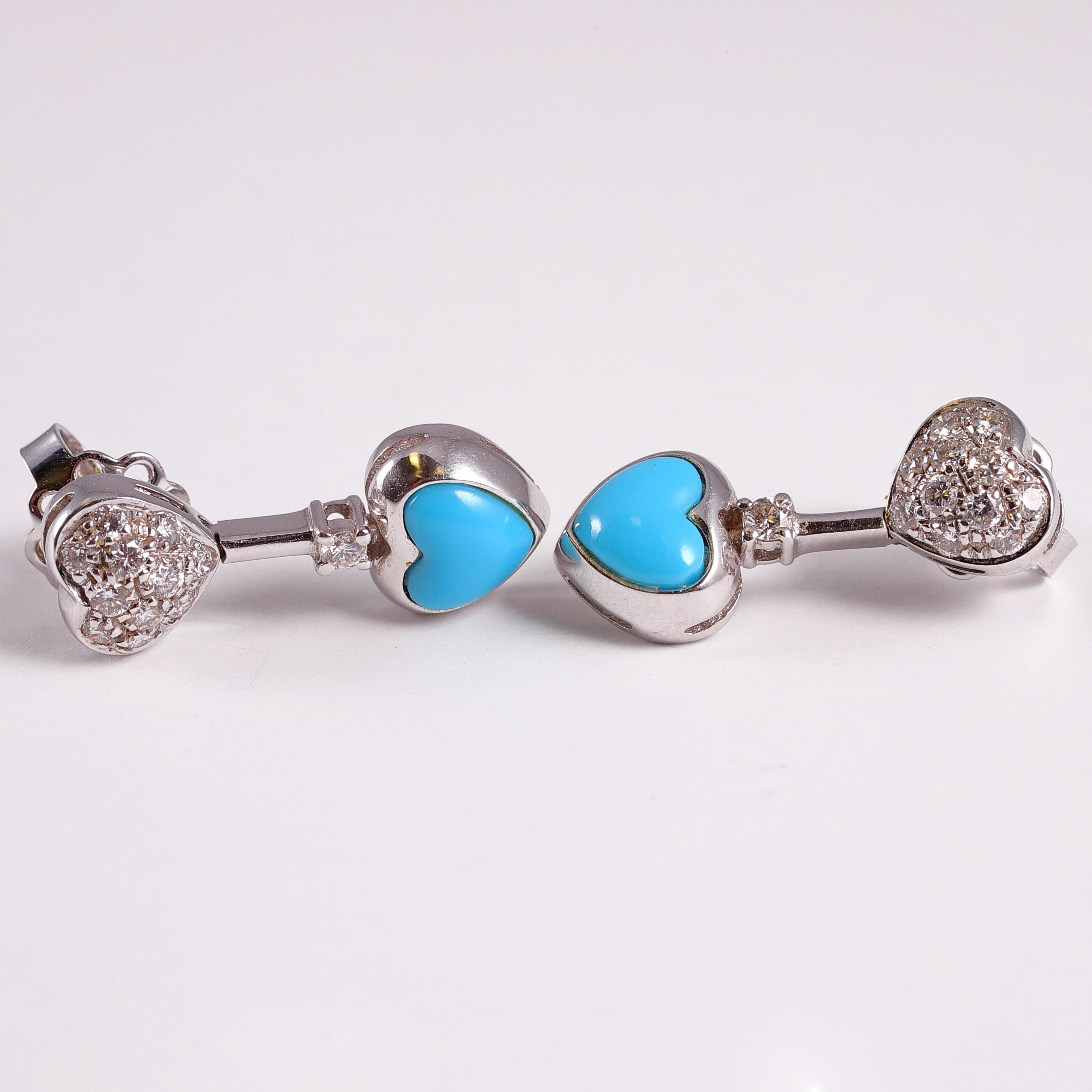 Composed of 18 karat white gold, the heart-shaped stabilized turquoise stones have been tested by Stone Group Labs who found no dyes detected.  The bead-set diamonds are a lovely accent!