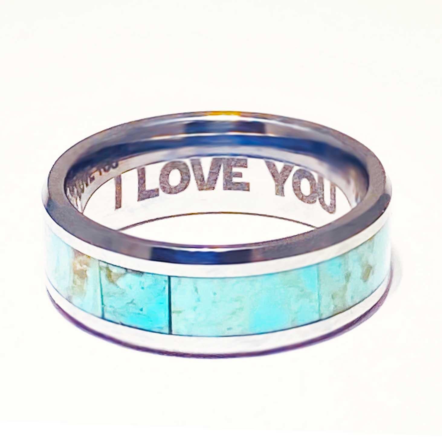 This men's wedding band is a statement fine jewelry piece! Natural turquoise inlay men's bands are a new and exciting design! The genuine turquoise gemstone inlay is a crystal blue color design inspired by clear blue ocean waters. The peaceful