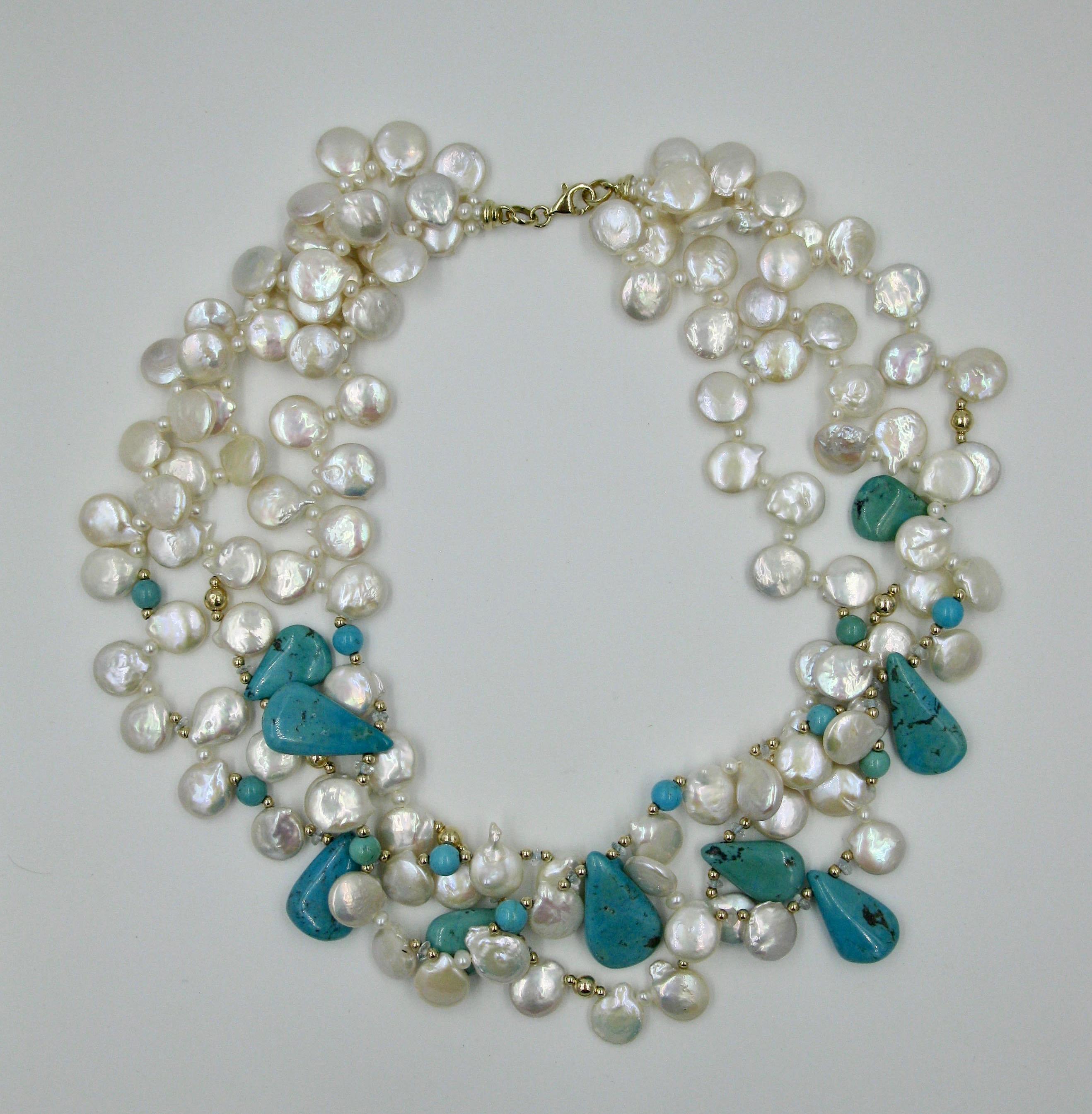 This is a stunning Turquoise and Keshi Pearl triple strand Necklace in 14 Karat Yellow Gold.  The natural mined Turquoise are pear shaped and round with wonderful Sleeping Beauty color and natural striation within the gems.  The turquoise is set