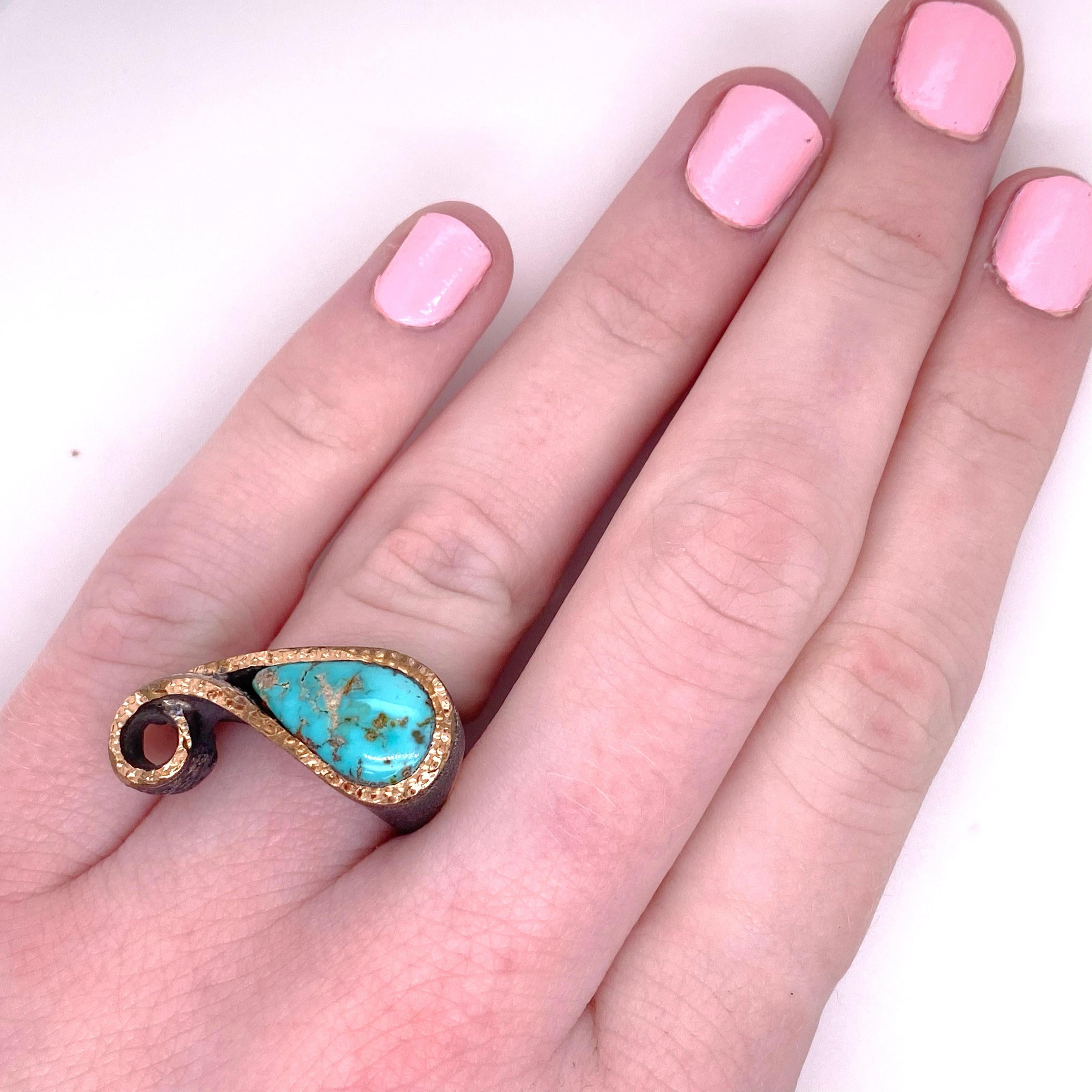 This turquoise ring is a pear shaped horizontal design that is very unique! It is called a knuckle ring because the silver is convexed next to the finger and is very comfortable to wear! The beautiful turquoise gemstone is natural and has a