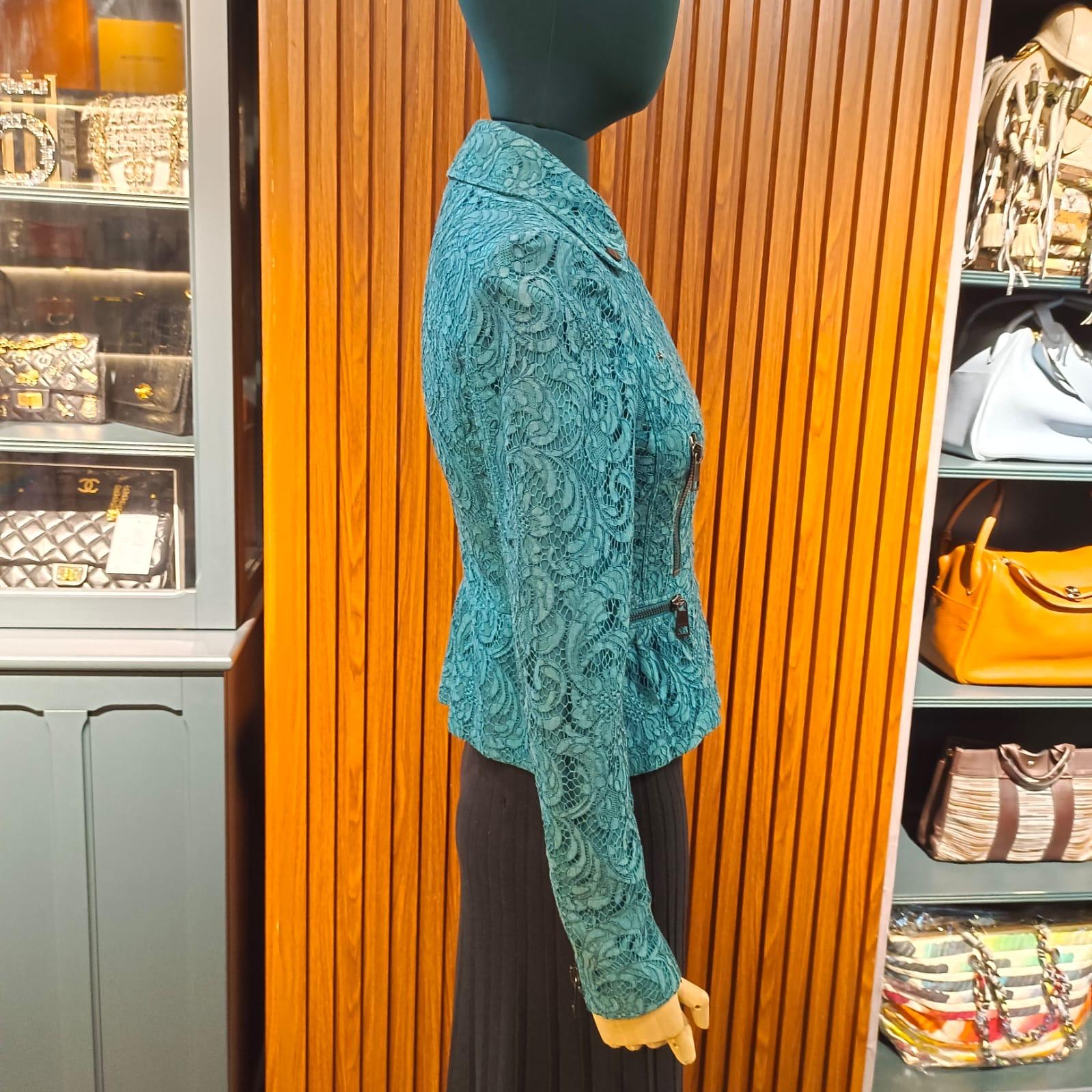 Burberry biker jacket in turquoise color. Beautiful rich turquoise the picture does not do justice. Slight discoloration on the collar line. Minor lace pull on some area but not thoroughly visible. Size US 4/ UK 6. Fits like XS.