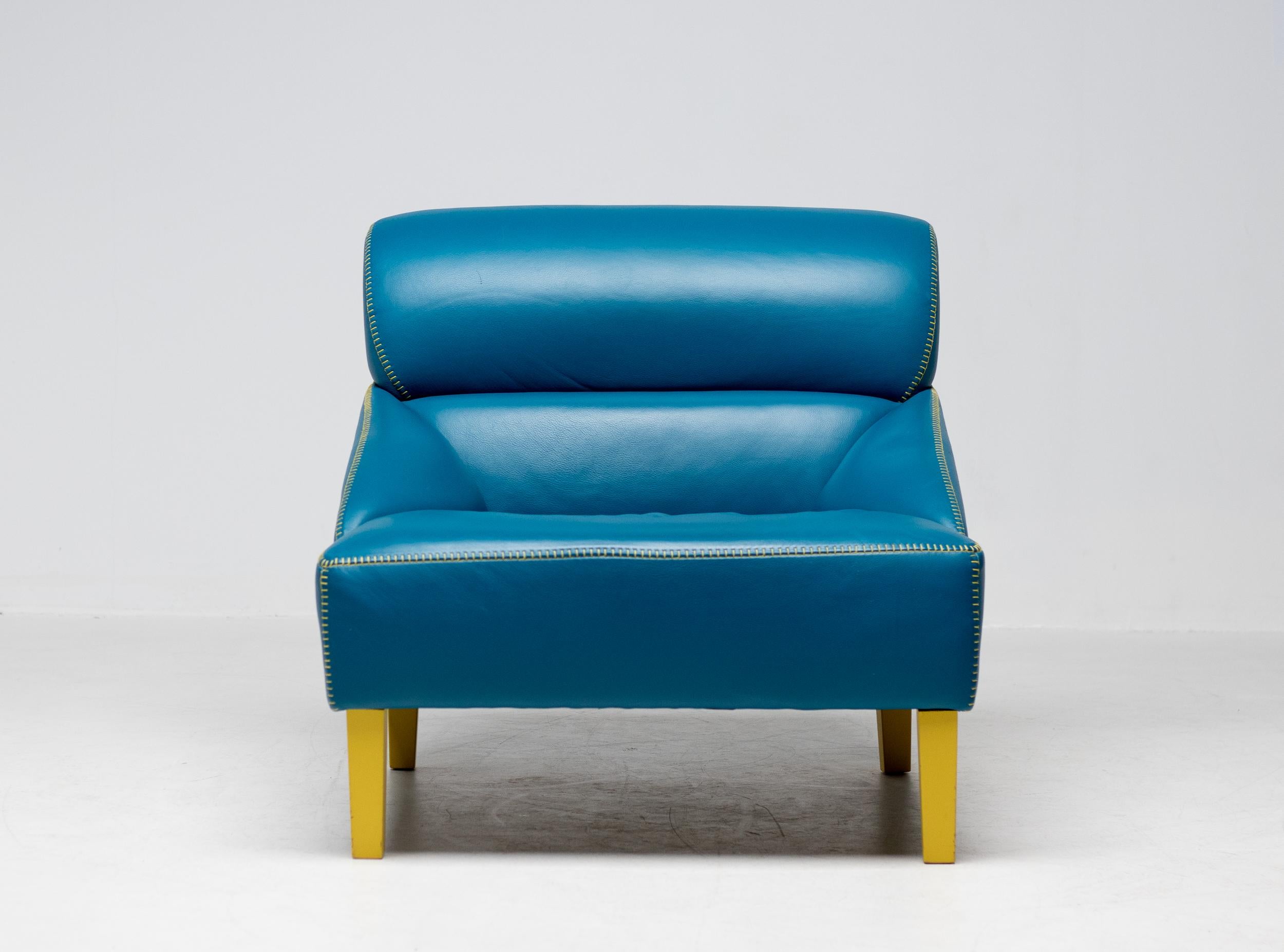 Turquoise leather love seat for Nicole Italia.
The choice for turquoise leather with contrasting yellow stitching and legs form an attractive combination.

Founded by Nicola Palasciano, Nicole Italia has become an internationally successful