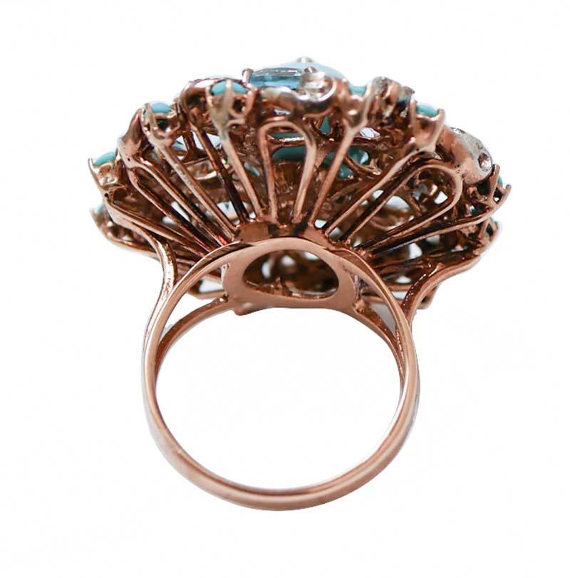 Amazing ring in 14 kt rose gold and silver structure mounted with a central magnesite with a diamond in the central part surrounded by topaz, diamonds and little turquoise.
This ring was totally handmade by Italian master goldsmiths and it is in