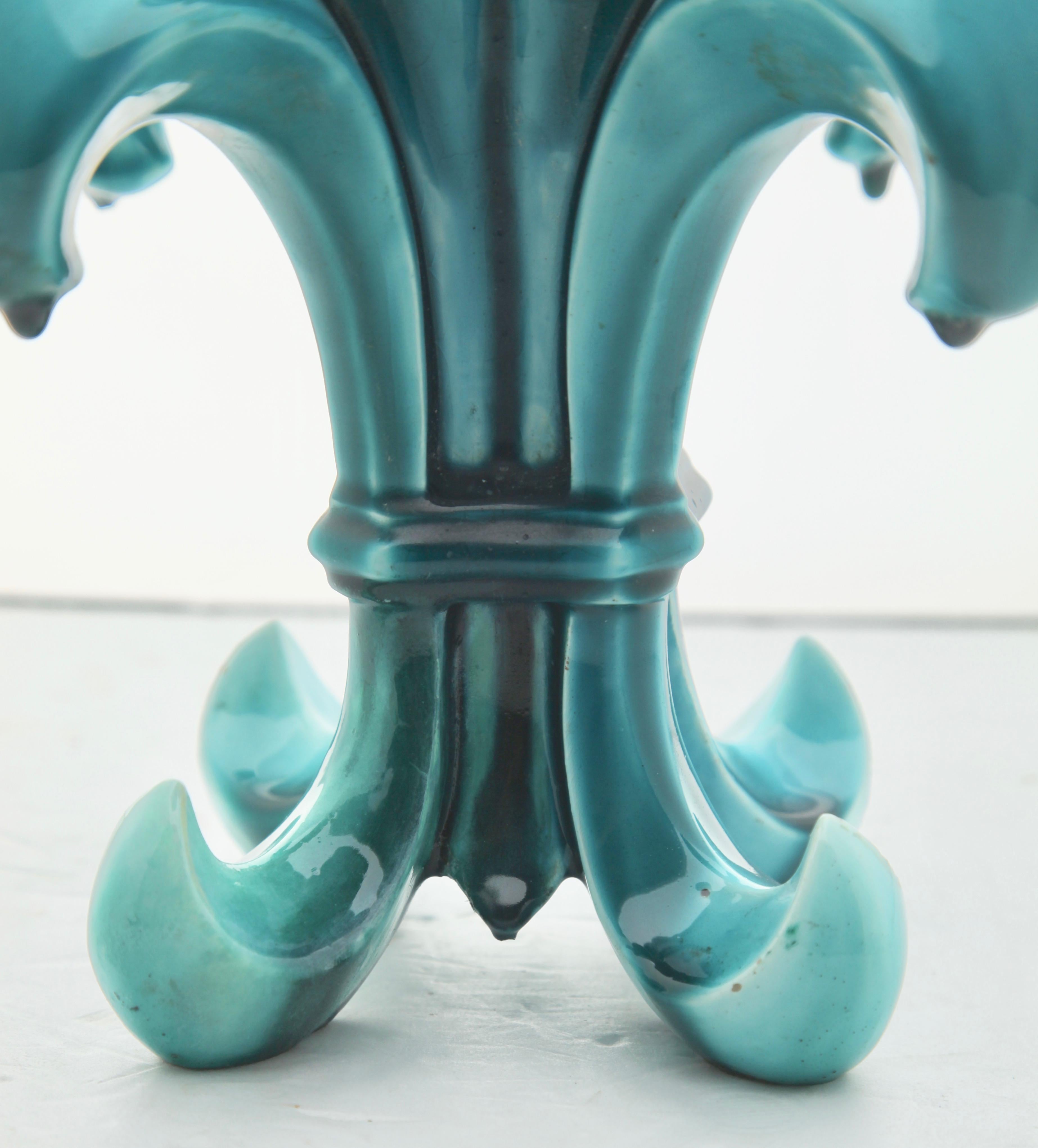 Art Nouveau turquoise Majolica Fleur Lys double by Jerome Massier & Fils at Vallauris
This stylish piece is an early example by a renowned maker, showing the main inspirations of Art Nouveau, applying curved, organic and asymmetrical design-elements