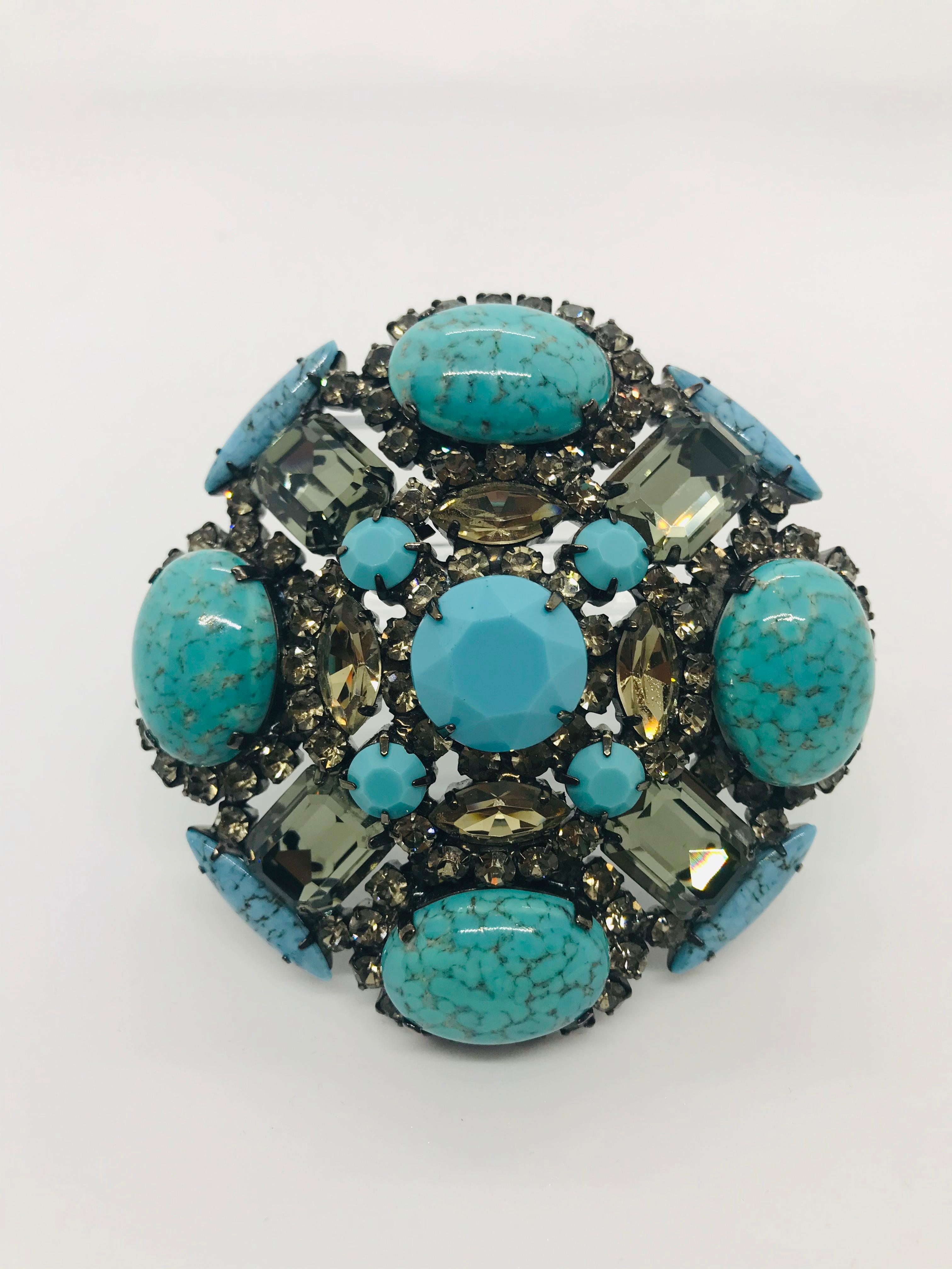 This bold domed, turquoise matrix and black diamond Austrian crystal Maltese cross brooch features a rare, large, round 1960s vintage Swarovski turquoise stone and four Czech turquoise matrix oval cabochon stones.  A great brooch to wear on the