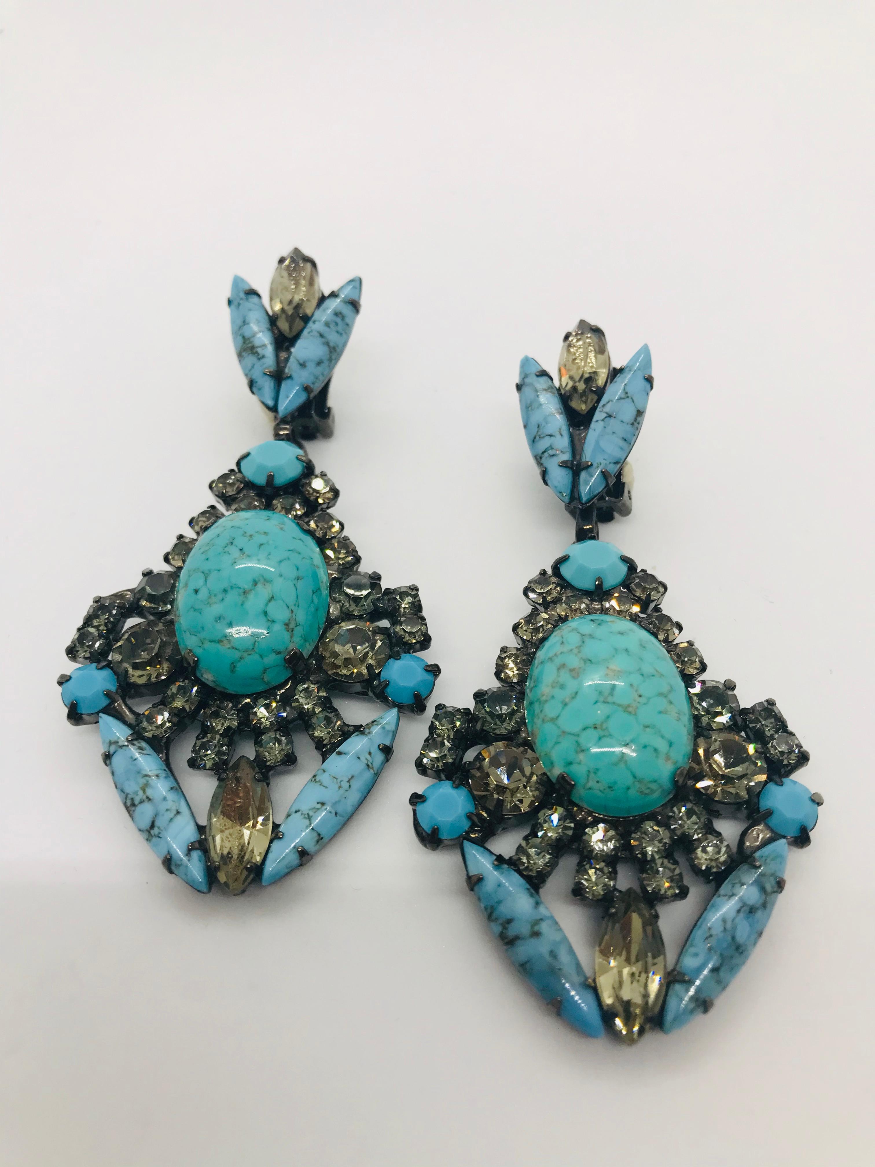 A pair of turquoise matrix and black diamond Austrian crystal pendant drop earrings featuring 1960s Czech turquoise matrix oval cabochons and navettes with vintage Swarovski black diamond round crystals.  These earrings feature clip backs and a