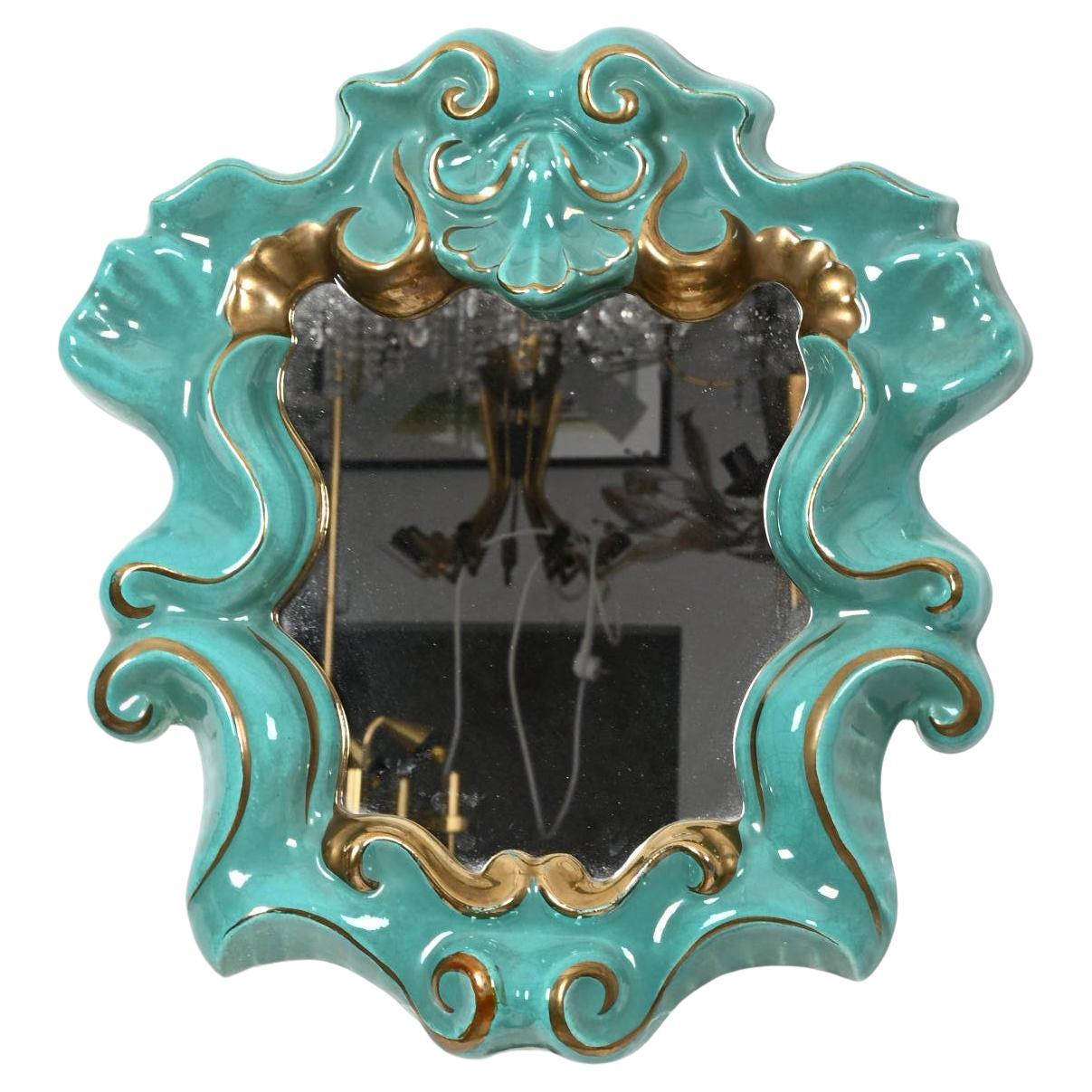 Raro specchio con cornice in ceramica turchese e oro. Prodotto nel 1930 in Austria da Gmundner Keramik 

