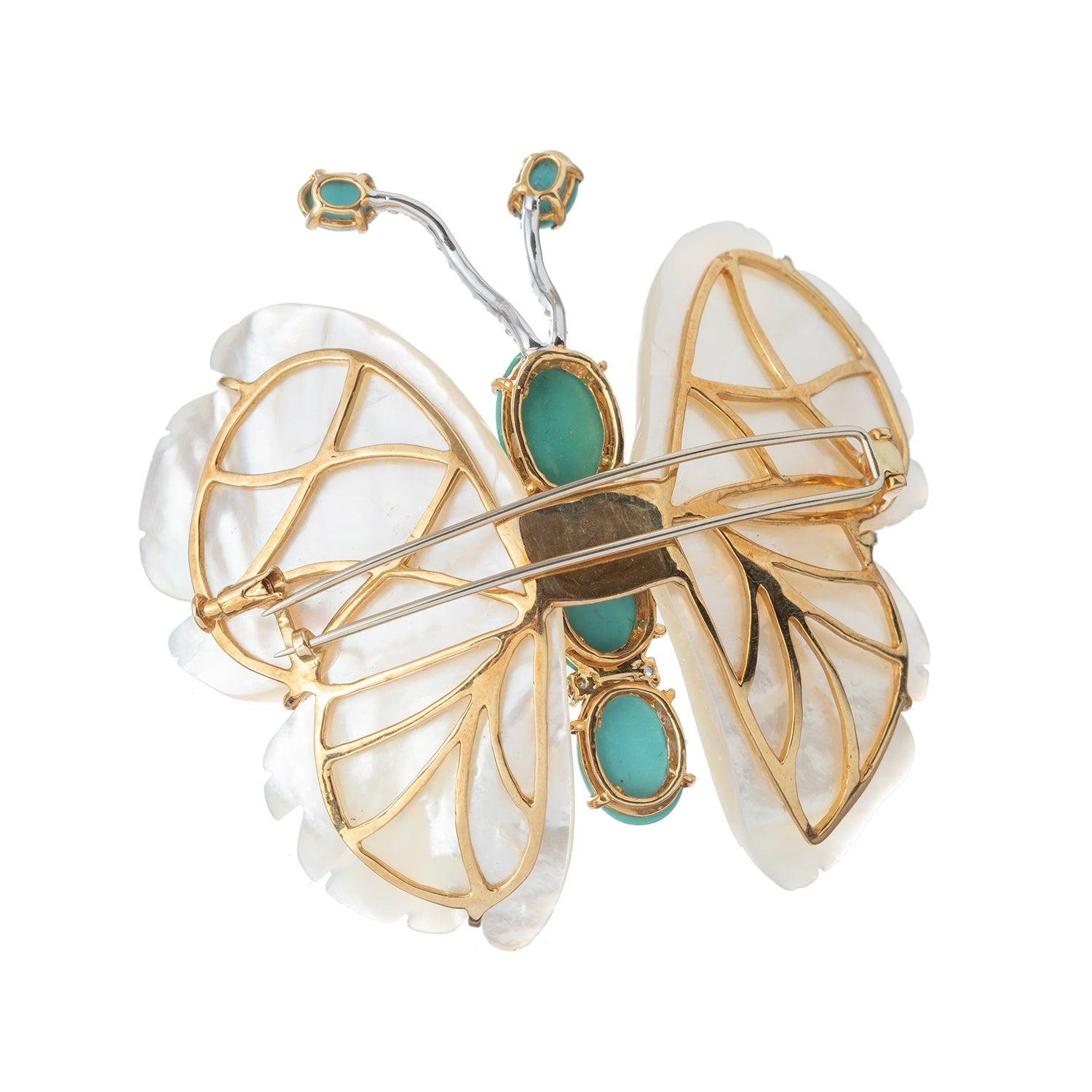 Butterfly brooch, featuring carved mother-of-pearl wings and oval-shaped cabochon turquoise body, as well as round-cut diamond-set antennae ending in oval-shaped cabochon turquoise with four round, faceted, natural blue sapphire in between. Handmade