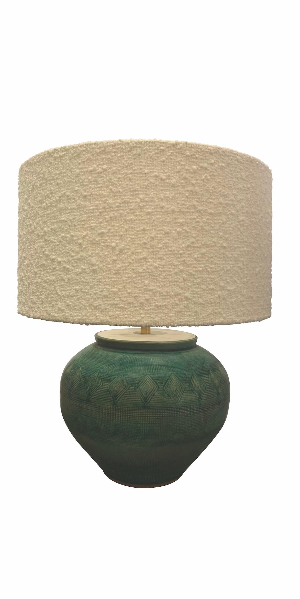 Contemporary Chinese pair of round shaped lamps with a crackled mottled turquoise glaze.
Boucle shades included.
Base measures 12