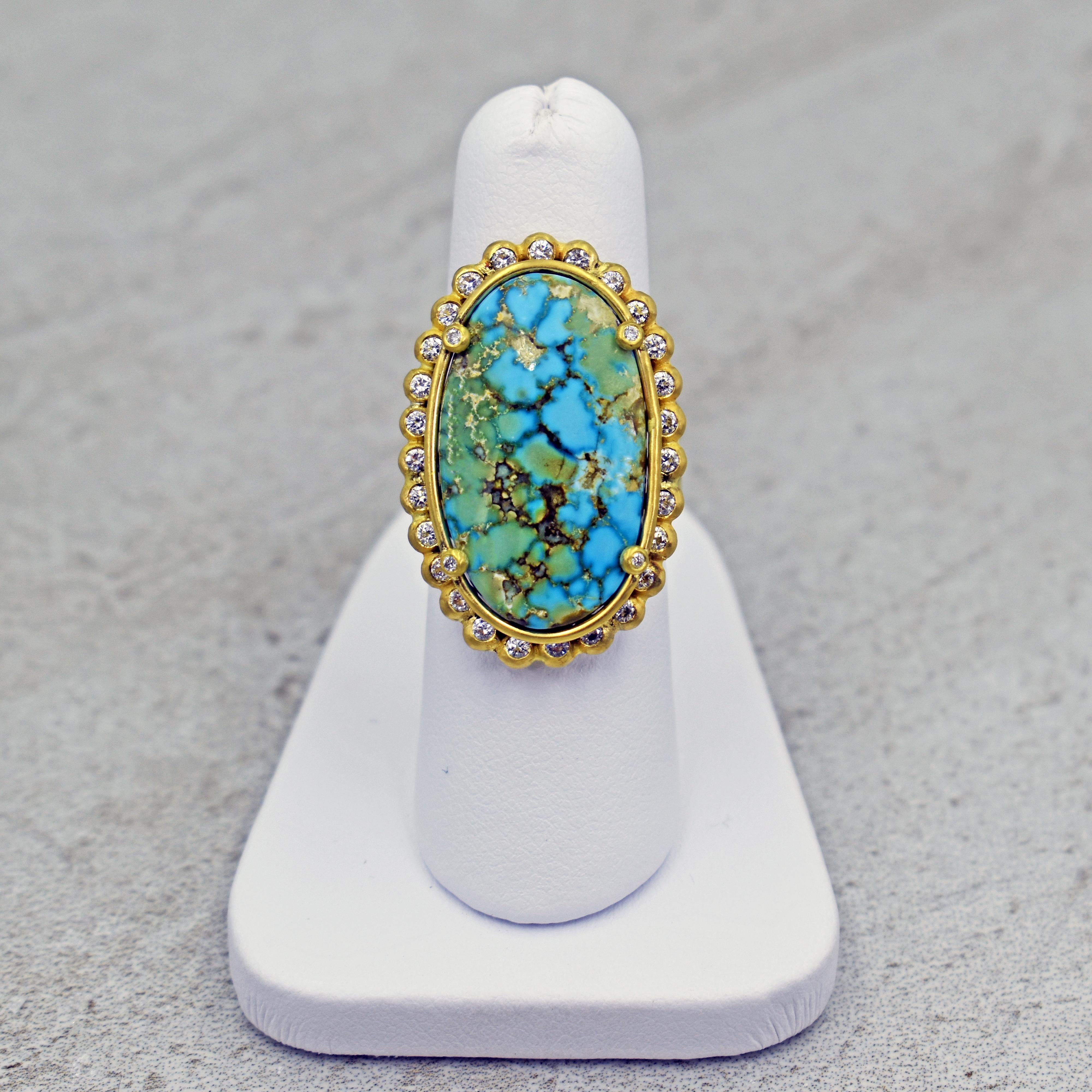 Gem-grade Turquoise Mountain center stone set in diamond halo (0.56 total carat weight, G-H, SI1) and 22k yellow gold cocktail ring. Size 7. Gorgeous, handmade statement ring featuring a beautiful turquoise gemstone from the mine in Arizona, USA. 