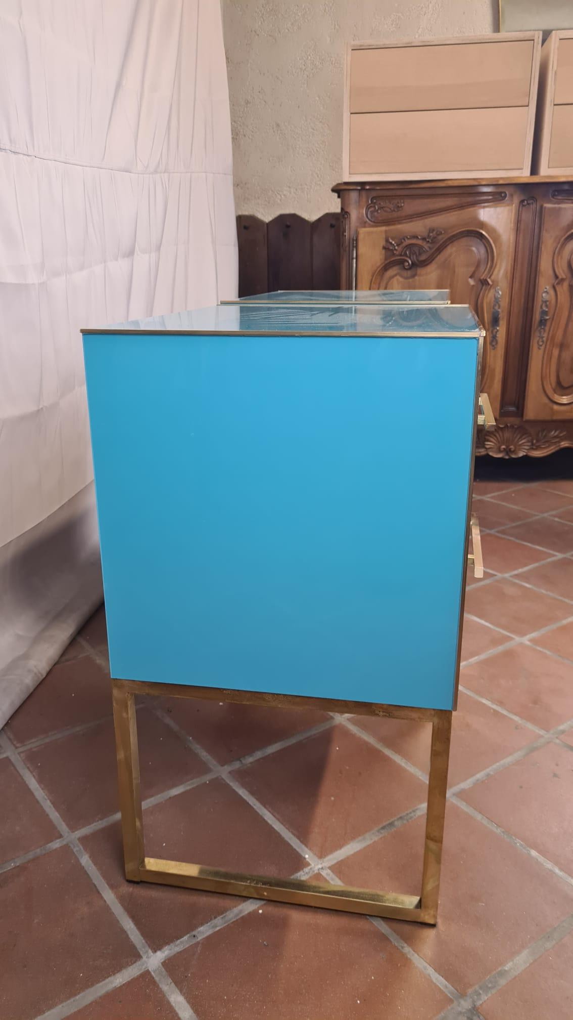 Discover the exquisite craftsmanship of our Light Blue Murano Glass Bedside Tables, a testament to the timeless elegance of Italian design. 

Handcrafted in 2022, these unique pieces blend traditional Murano glass artistry with modern Mid-Century