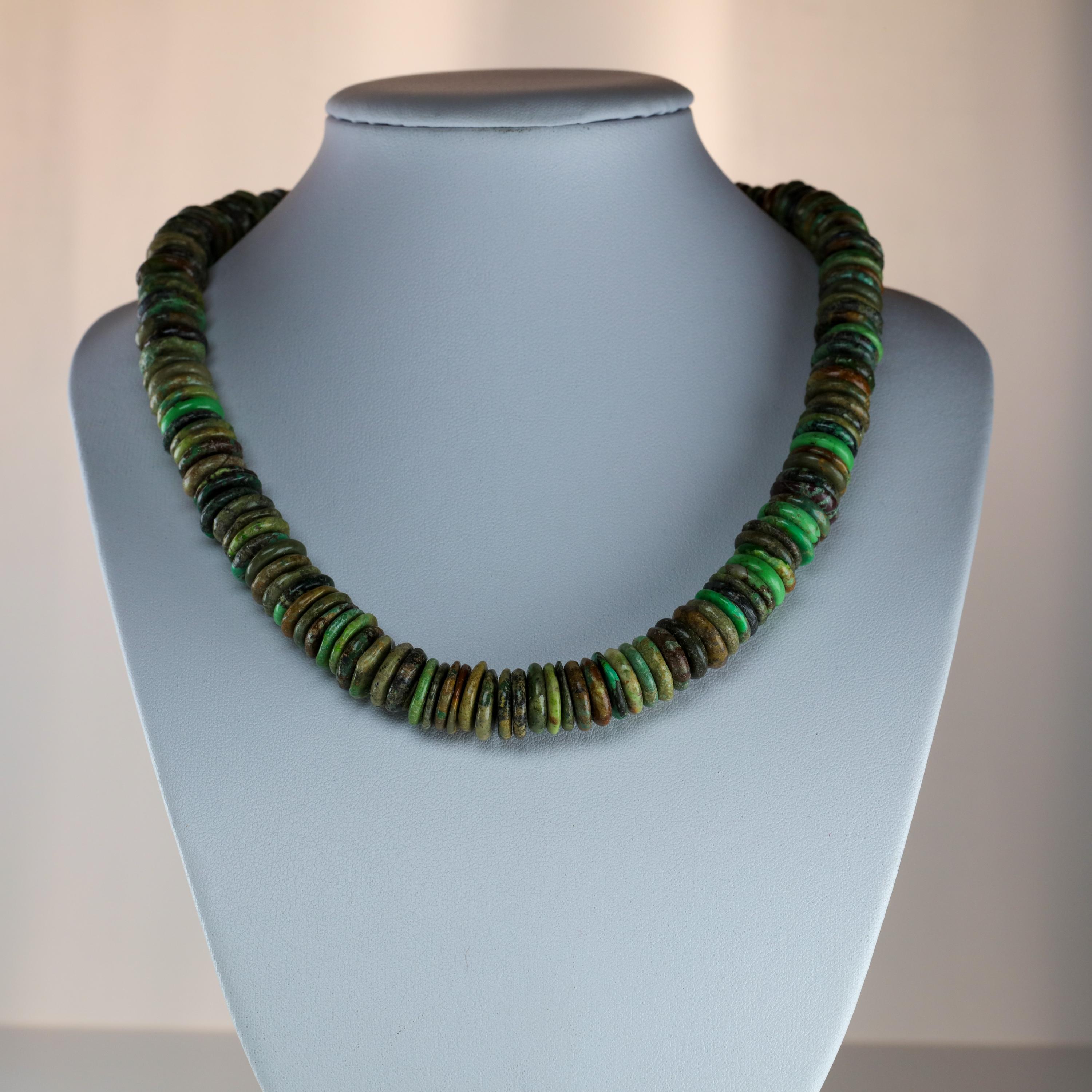 In my many years of collecting jewelry, I have never come across a necklace quite like this one. The 16.5-inch choker-length necklace is composed of 164 approximately disks of fine, natural and un-treated turquoise disk beads, measuring