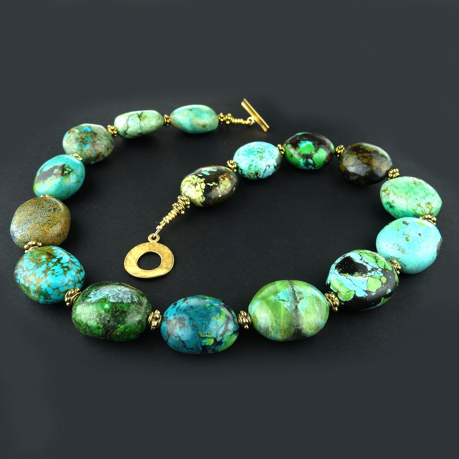 Custom made necklace of highly polished Turquoise nuggets in rich shades of blue and green laced with matrix.  Each of these nuggets is a fantastic landscape of color and design.  The 21x19MM nuggets are accented with detailed brass toned spacers