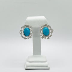 Turquoise Oval Cabochon and White Diamond Earrings in 18K White Gold