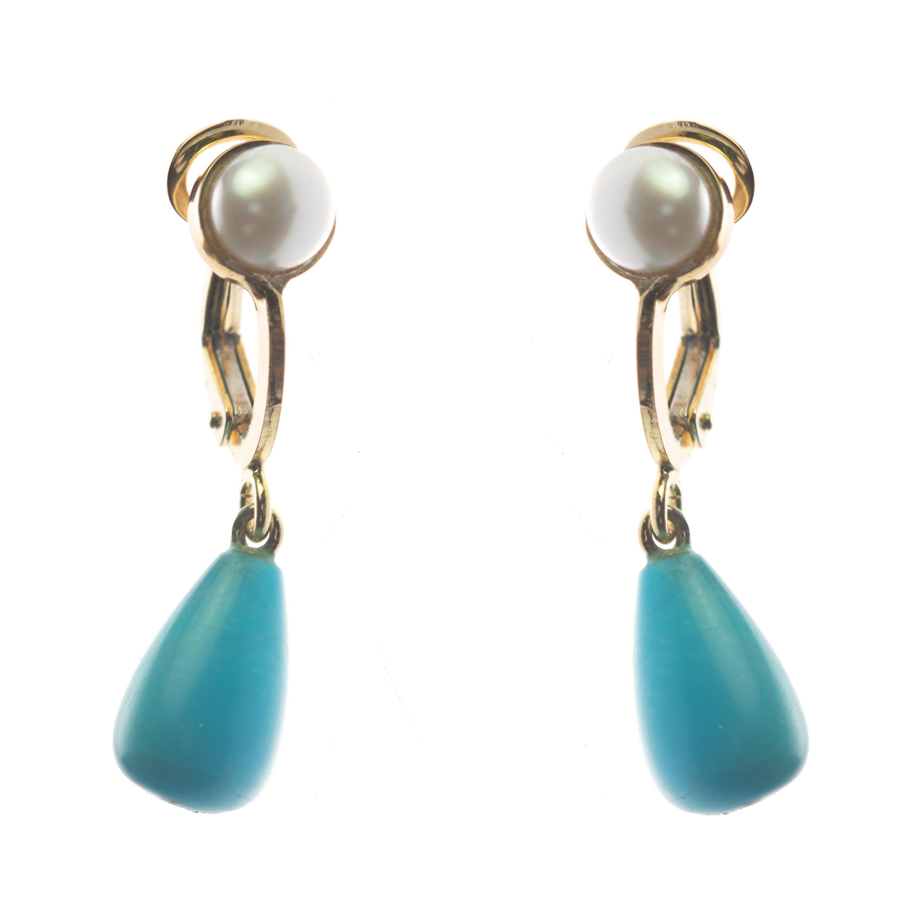 Marvelous 5 carat Turquoise pear drop jewel, embellished with a clip on marvelous clousure 18 karat yellow gold in a unique earwire earring. Let Intini Our traditonal Handmade Milanese brand, surprise you with fashionable accessories and make all