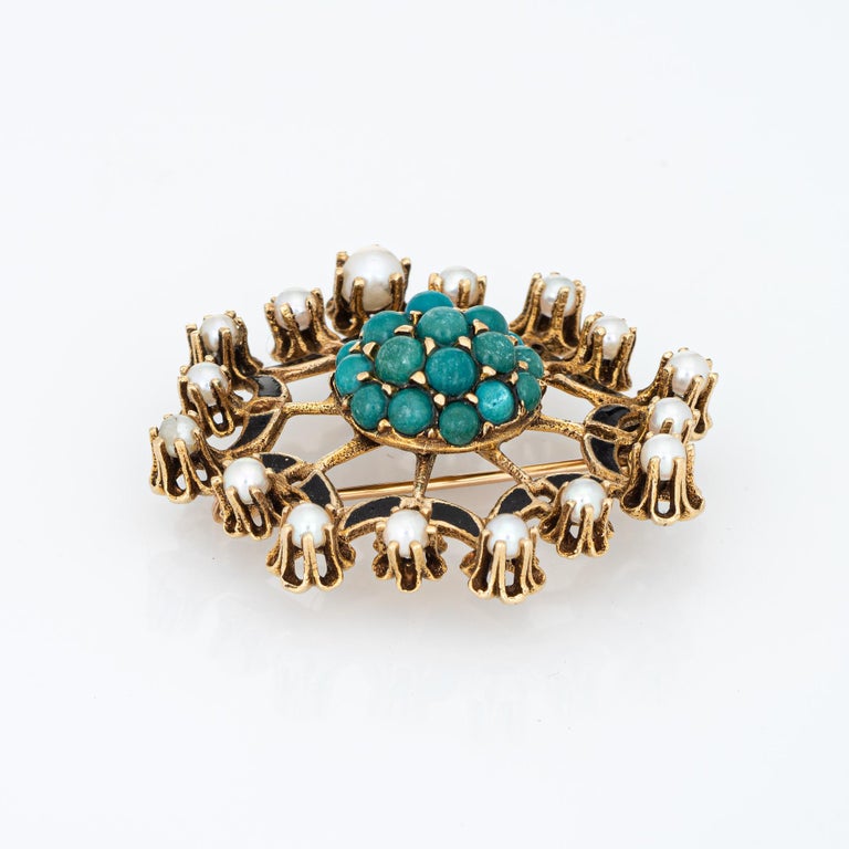 Finely detailed turquoise & cultured pearl pendant (brooch/in) crafted in 14k yellow gold (circa 1950s to 1960s).  

Cabochon cut turquoise measures from 2mm to 4mm. Cultured pearls graduate in size from 2mm to 3mm. Note: chip to one piece of