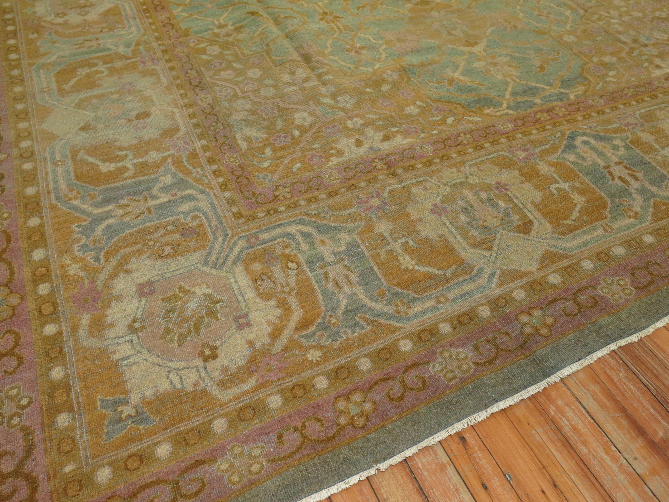 Stunning high decorative room size early 20th century antique Indian Amritsar rug from the early 20th century. Turquoise field, goldenrod, silver, and pink accents,

circa 1900-1910. Measures: 9' x 11'9