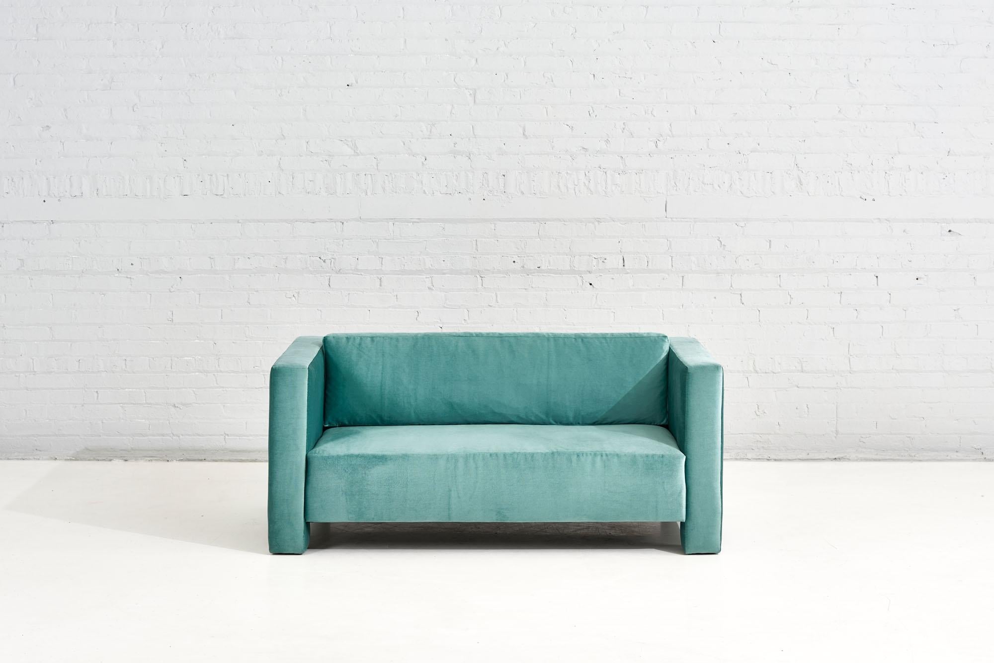 Turquoise Postmodern Cubic settee, 1970 Newly reupholstered in turquoise velvet.