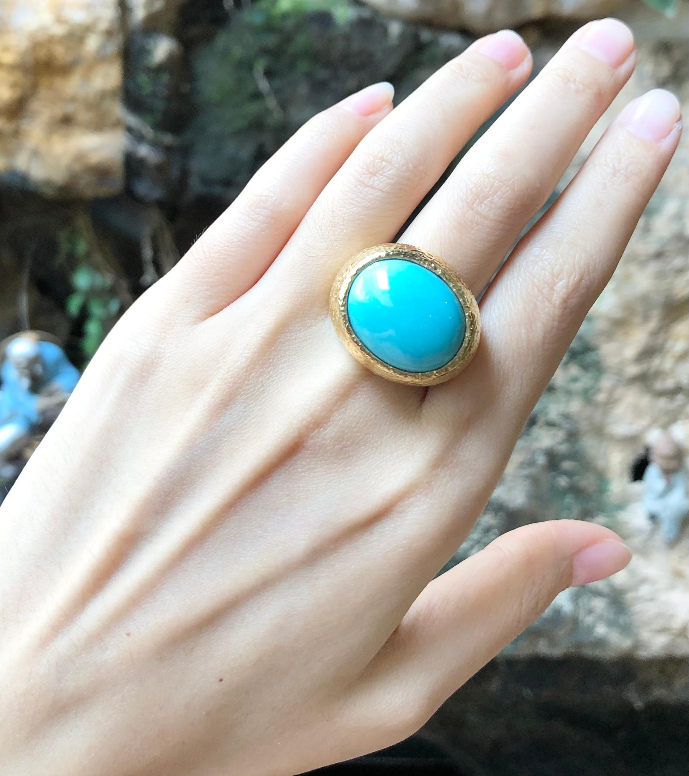 Turquoise Ring set in 18 Karat Gold Settings

Width:  2.3 cm 
Length: 2.1 cm
Ring Size: 56
Total Weight: 33.85grams

