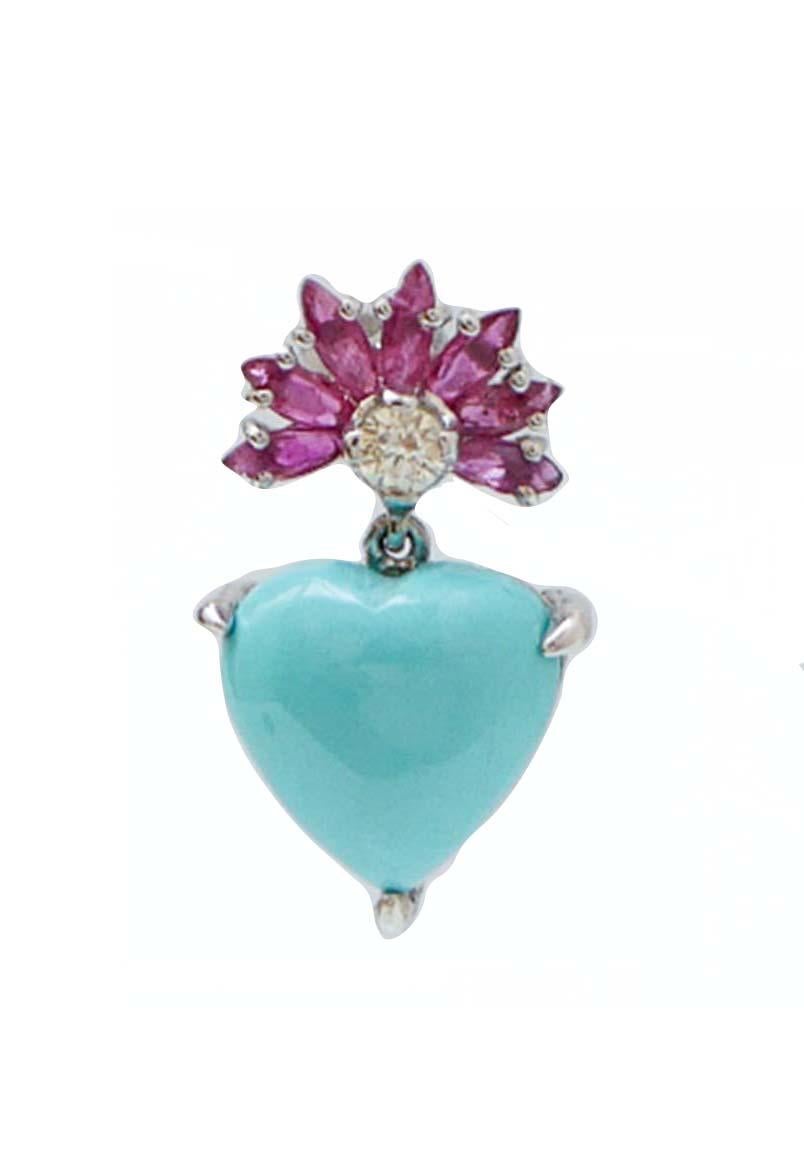 Fashion earrings in 14 kt white gold structure mounted with rubies and a diamond in the upper part. As pendant, an heart turquoise.
Diamonds 0.19 ct
Sapphires 1.90 ct
Turquoise 1.10 gr
Total Weight 3.60 gr
RF  ++GHFR

For any information, feel free