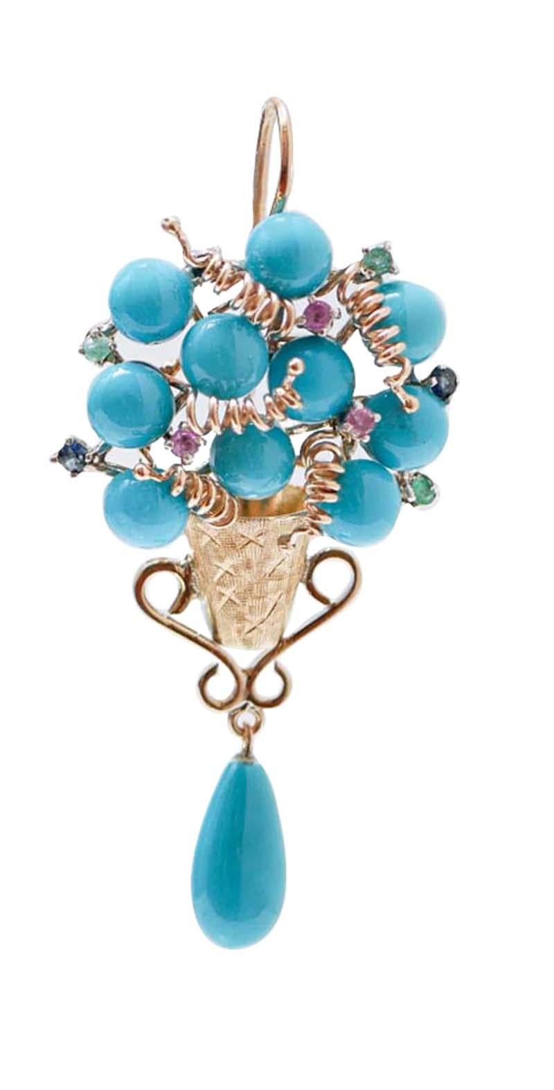 Fashion basket earrings in 9 kt rose gold and silver structure mounted with turquoise and, between of them, rubies, emeralds and sapphires. Below, a drop turquoise.
These earrings were totally handmade by Italian master goldsmiths and they are in