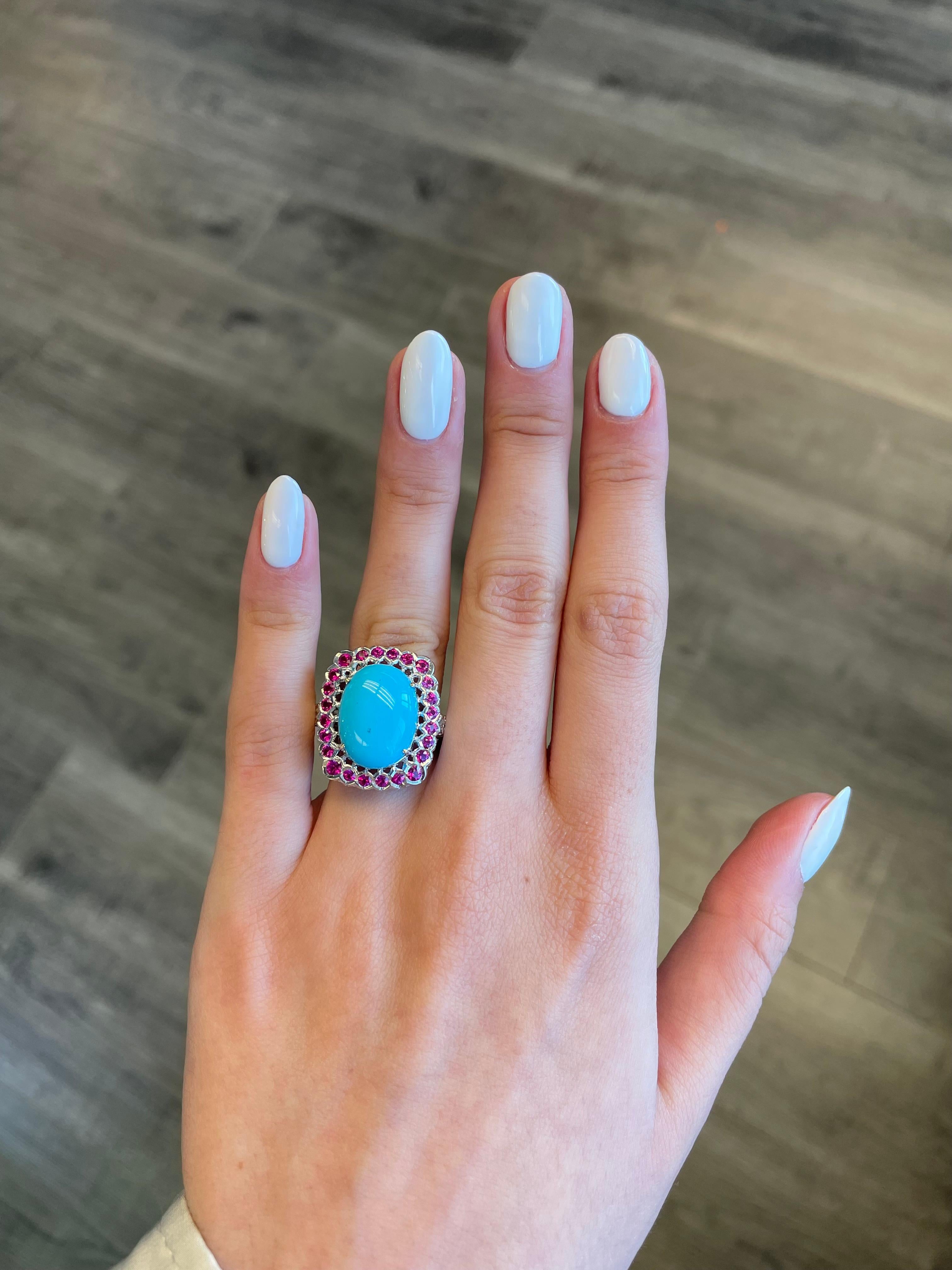 Exquisite and statement turquoise, ruby, and diamond ring. 
Center Arizona turquoise surrounded by 4.20ct of round rubies and 0.60ct of round brilliant diamonds. 4.80ct total gemstone weight set in 18-karat white gold with black rhodium.
