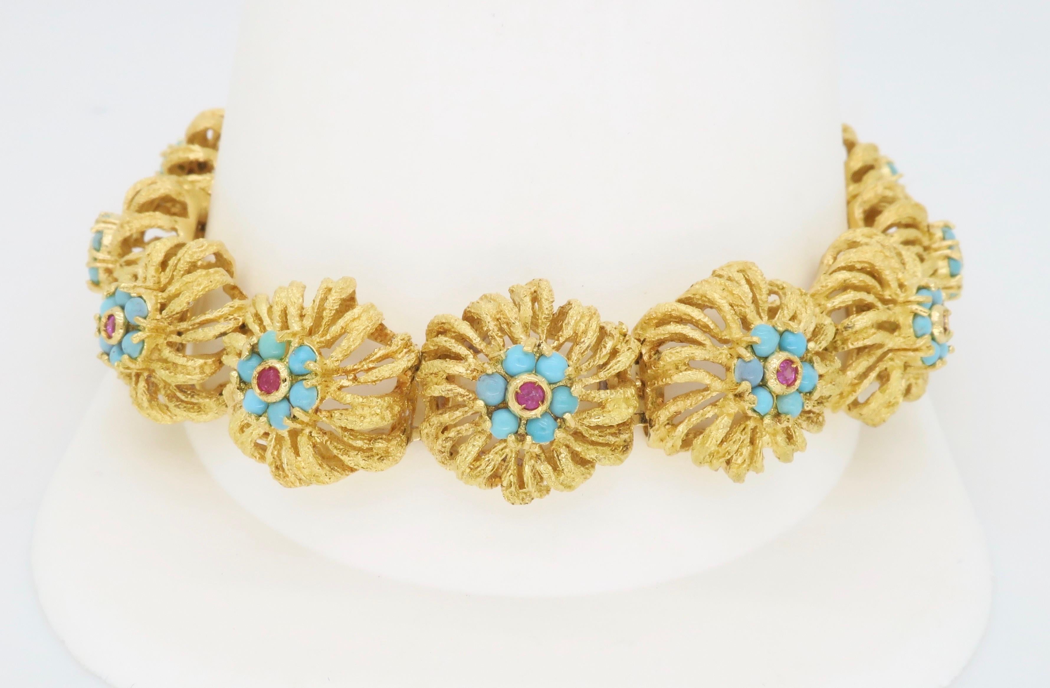 Intricate floral design Ruby & Turquoise bracelet made in 18k yellow gold.

Gemstone: Ruby & Turquoise 
Metal: 18k Yellow Gold 
Bracelet Length: 8