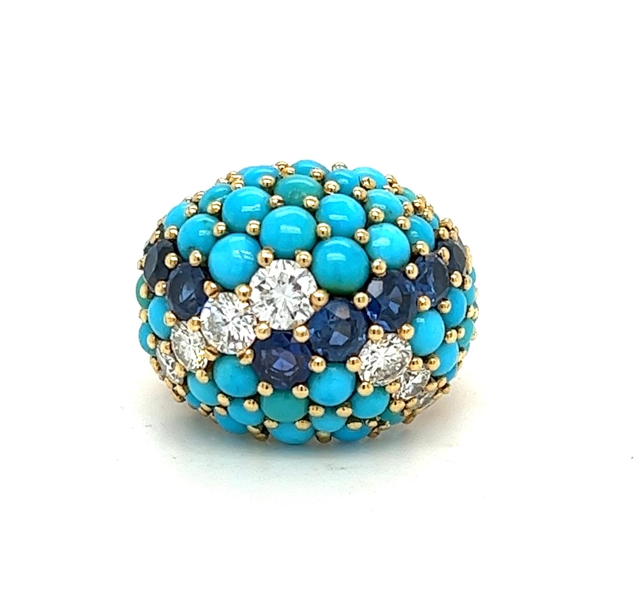 Offered here is one Yellow gold ( stamped on the outside of the shank with a French hallmark indicating 18K gold and an additional illegible stamp ) lady's high dome, bombe' shape turquoise, sapphire and diamond set ring.
The ring is multi-prong set